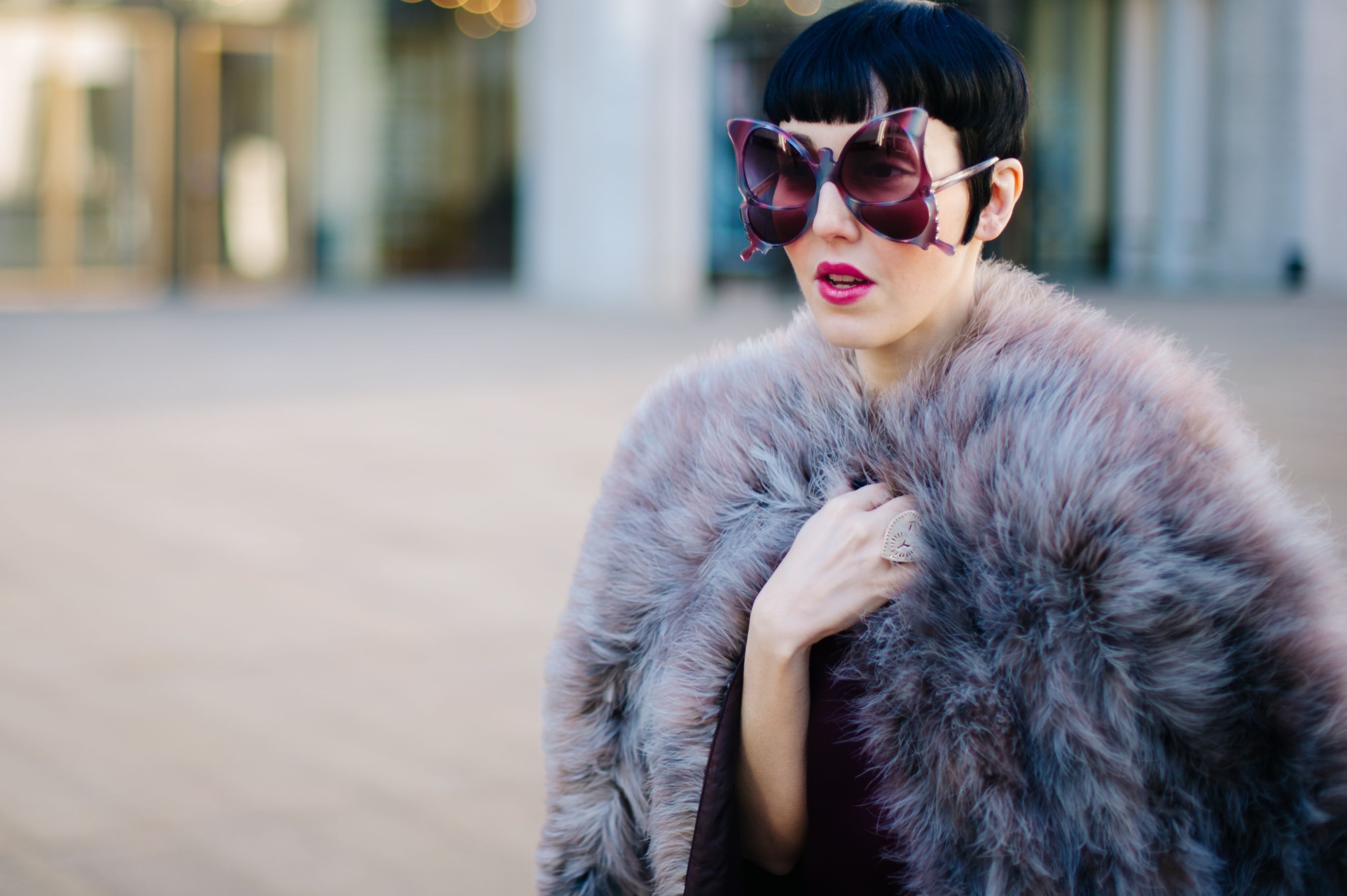 Model wearing butterfly glasses