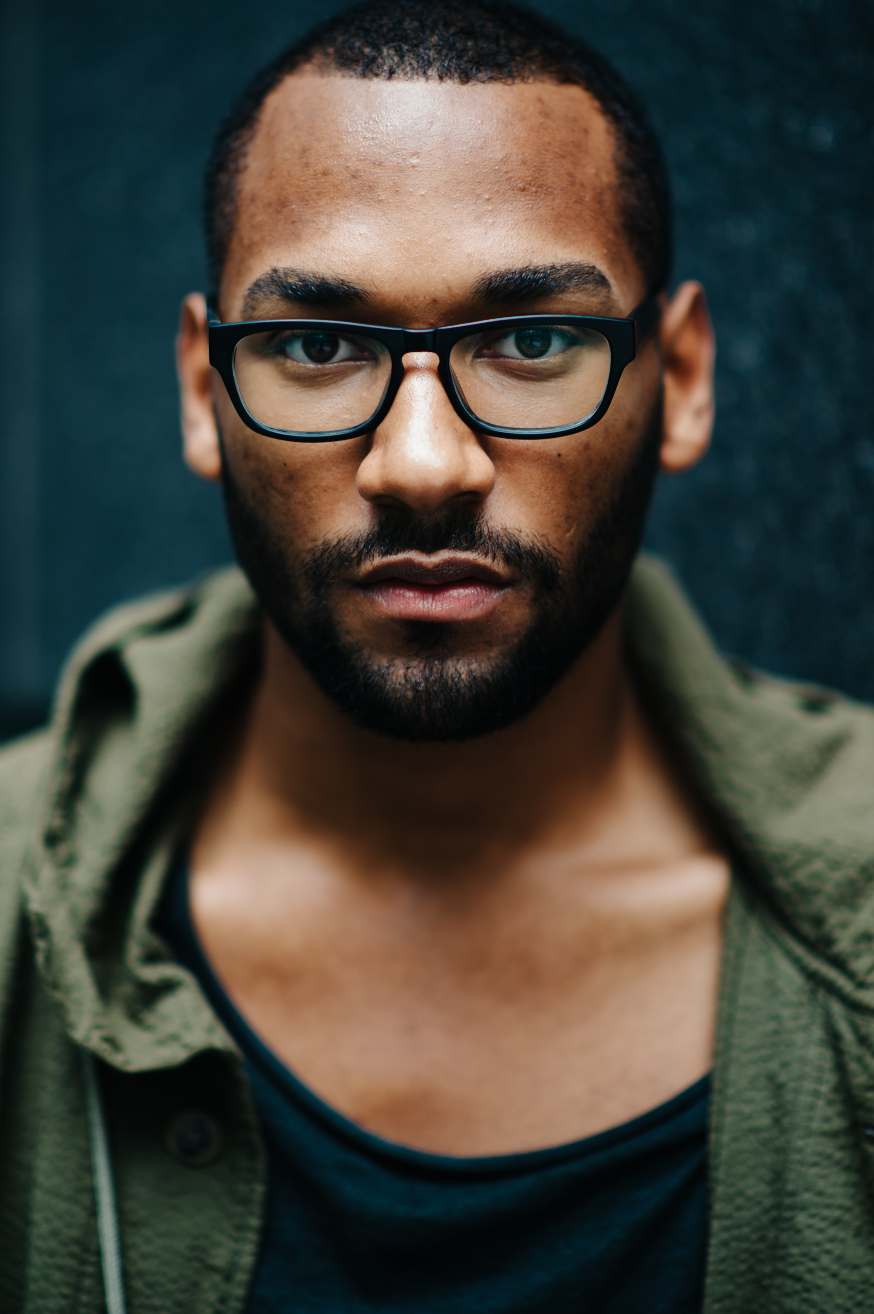 Portrait of a man wearing green