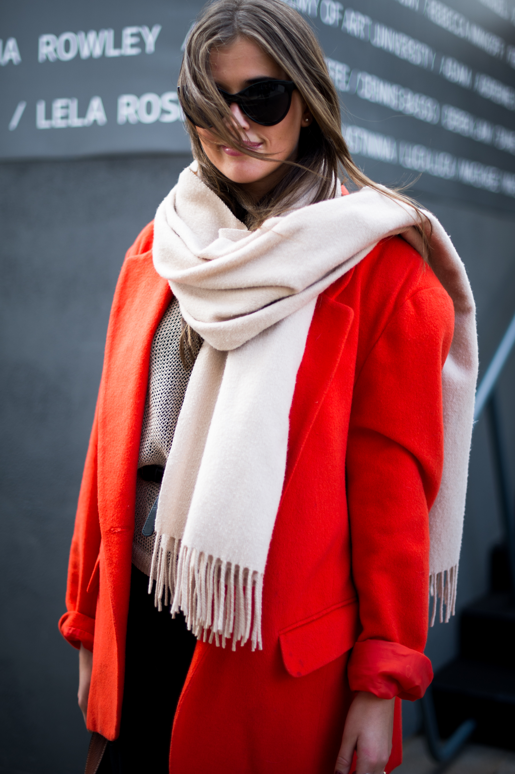 Woman wearing red coat and scarf