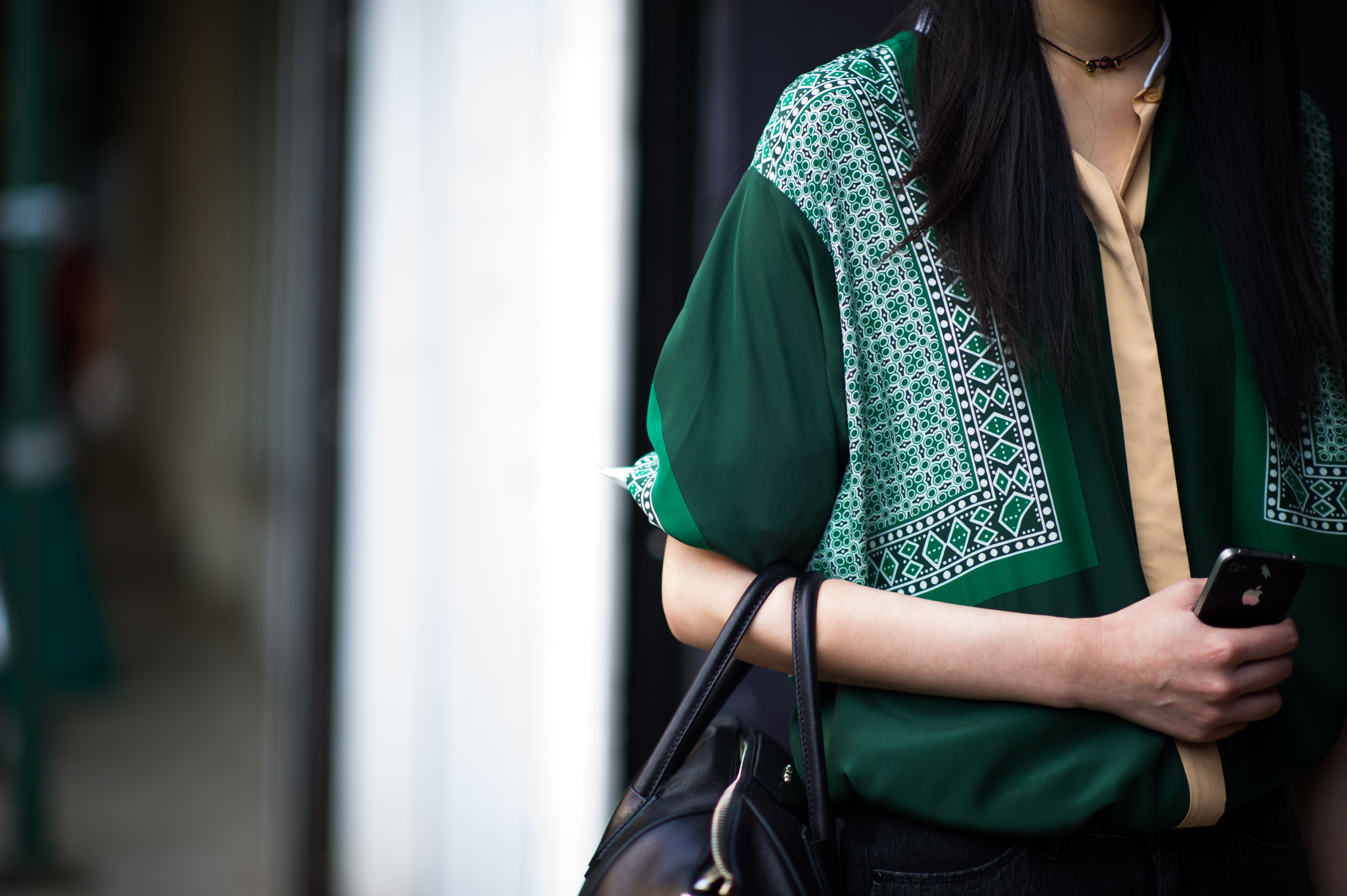Model wearing silk green top