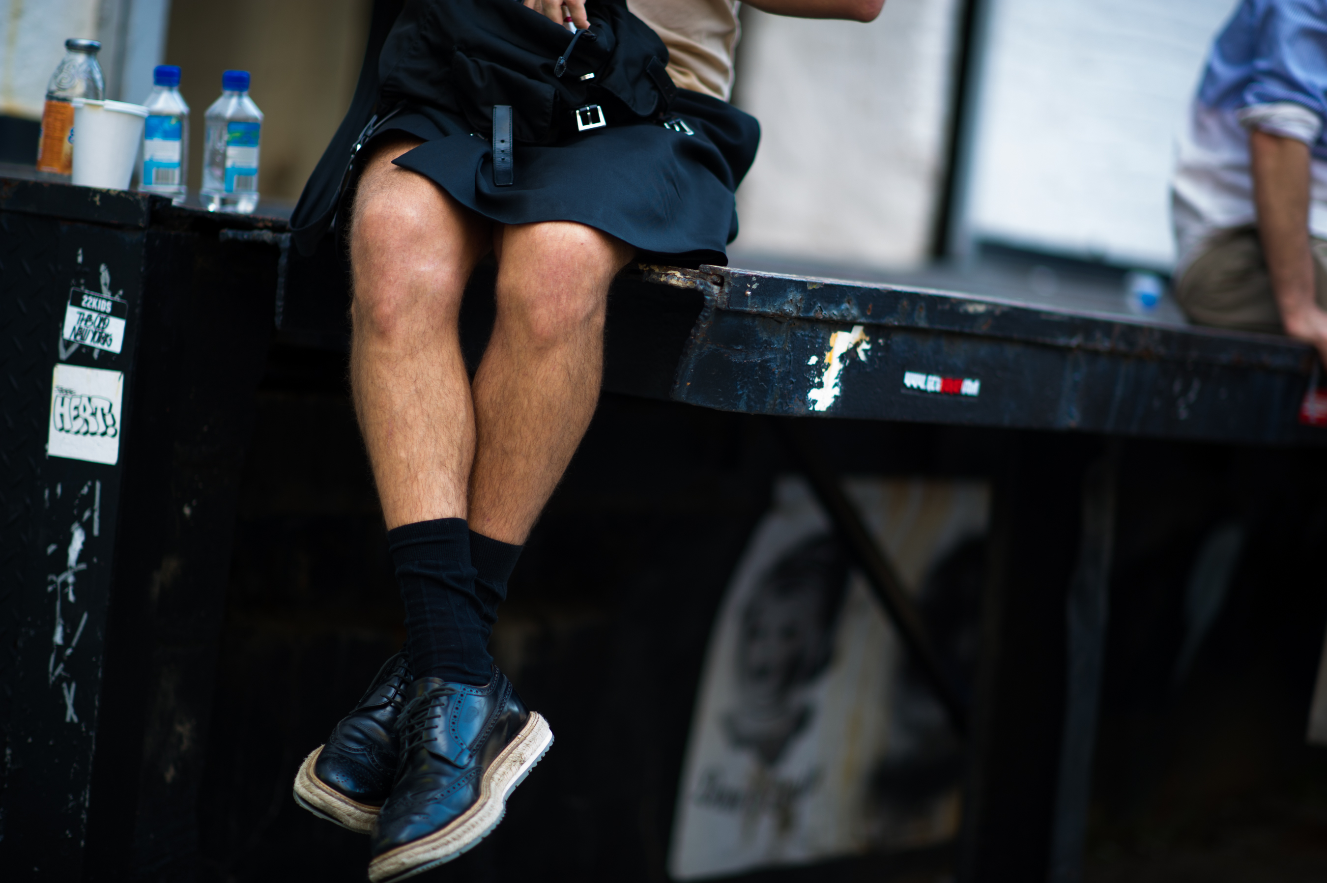 Man wearing black skirt