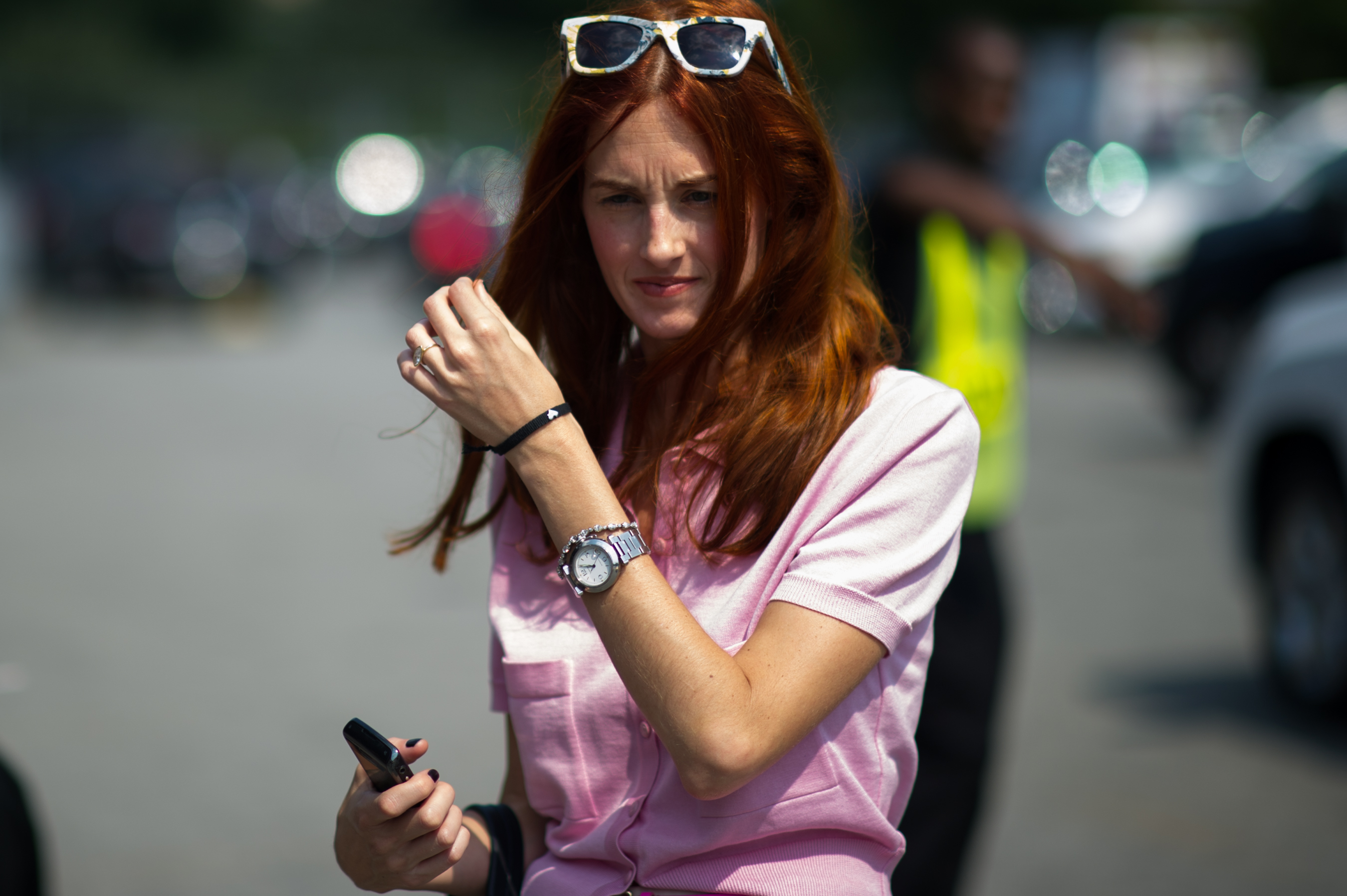 Woman with red hair pink shirt