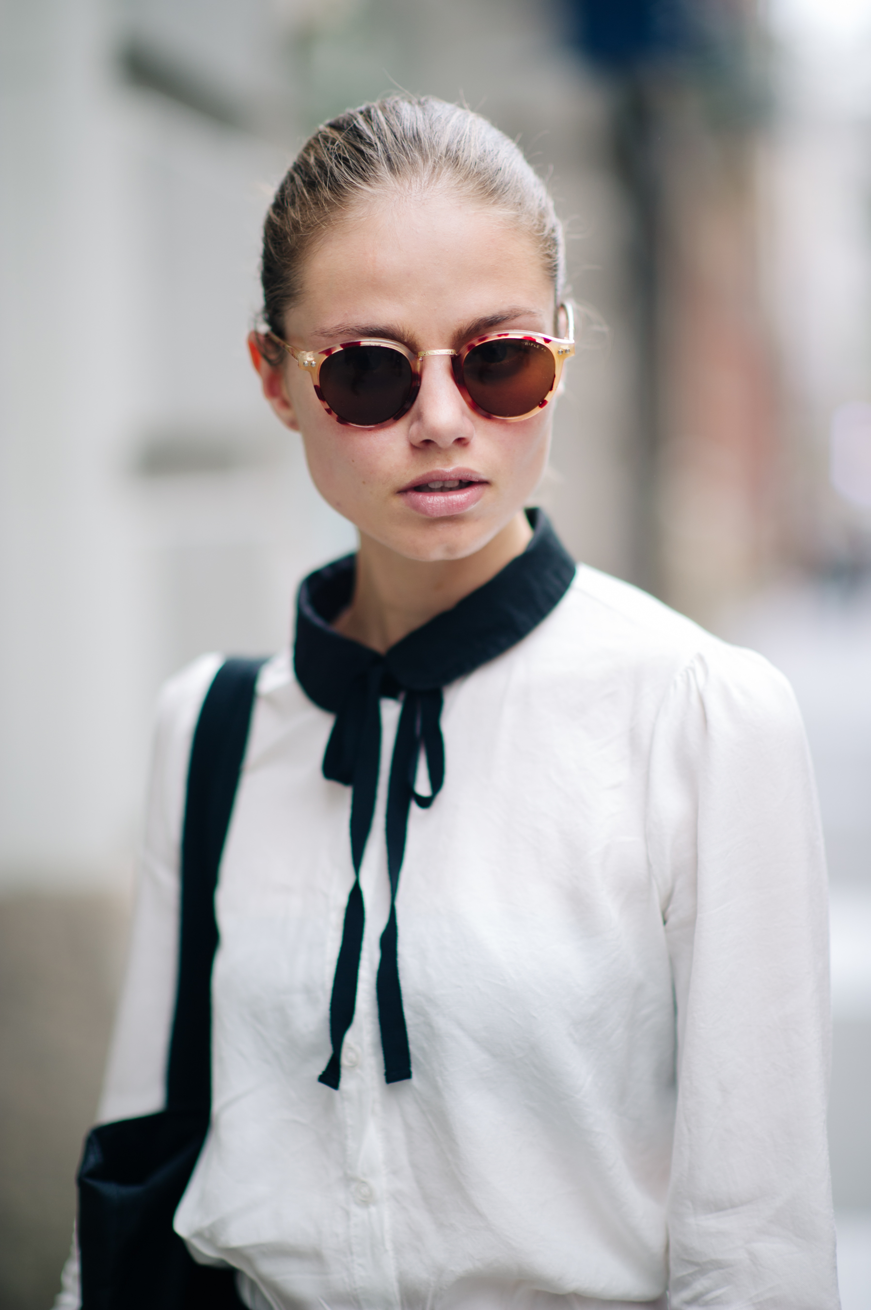 Model wearing white shirt black collar