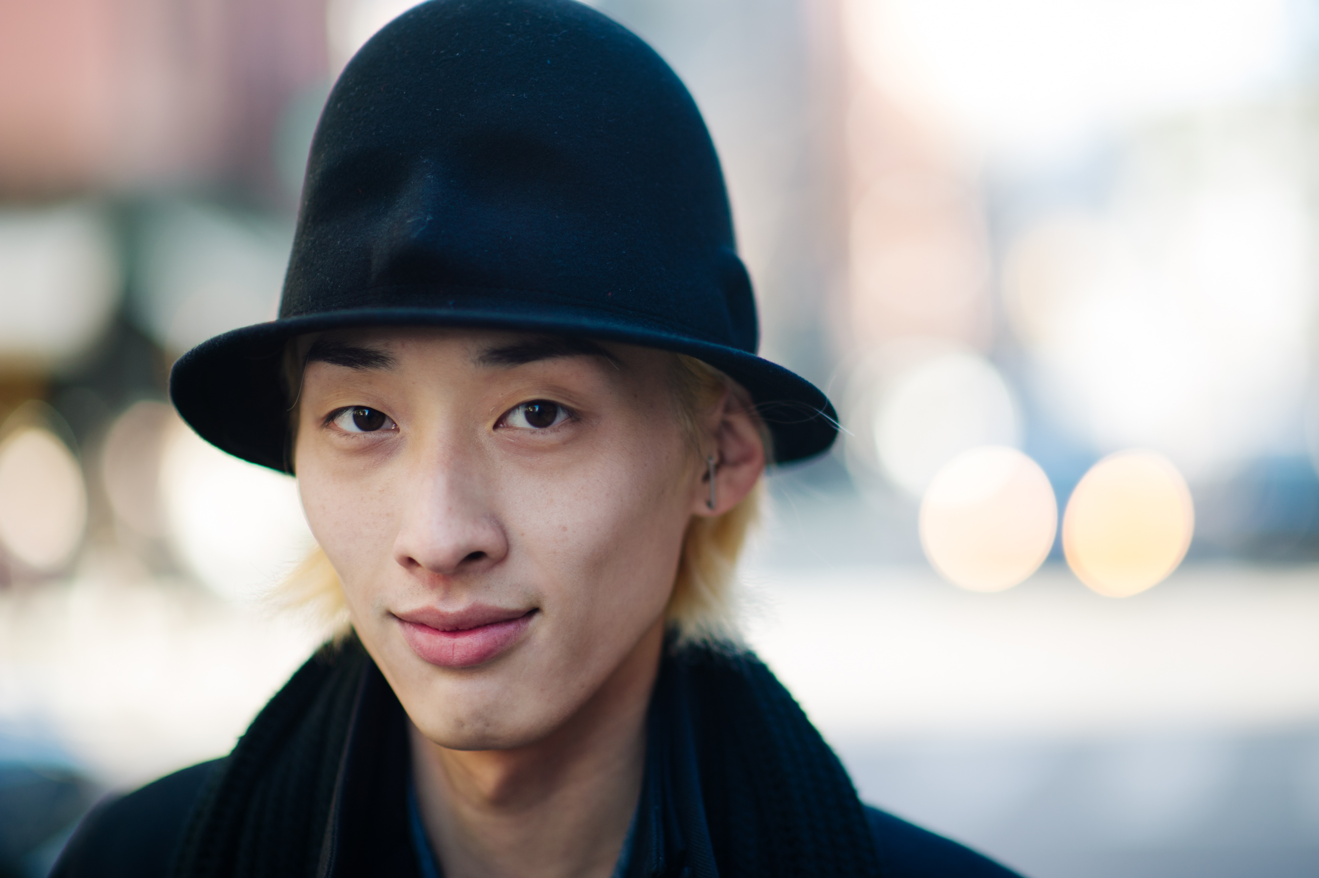 South Korean photographer wears hat
