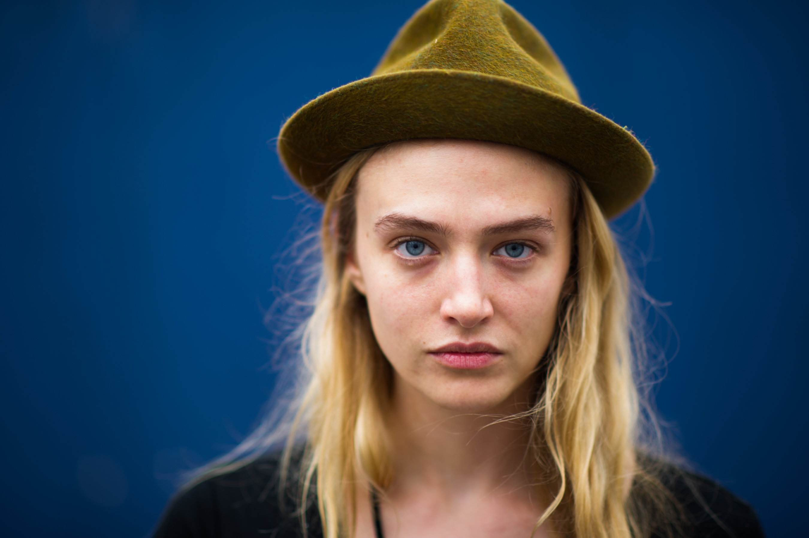 Portrait of a model wearing green hat