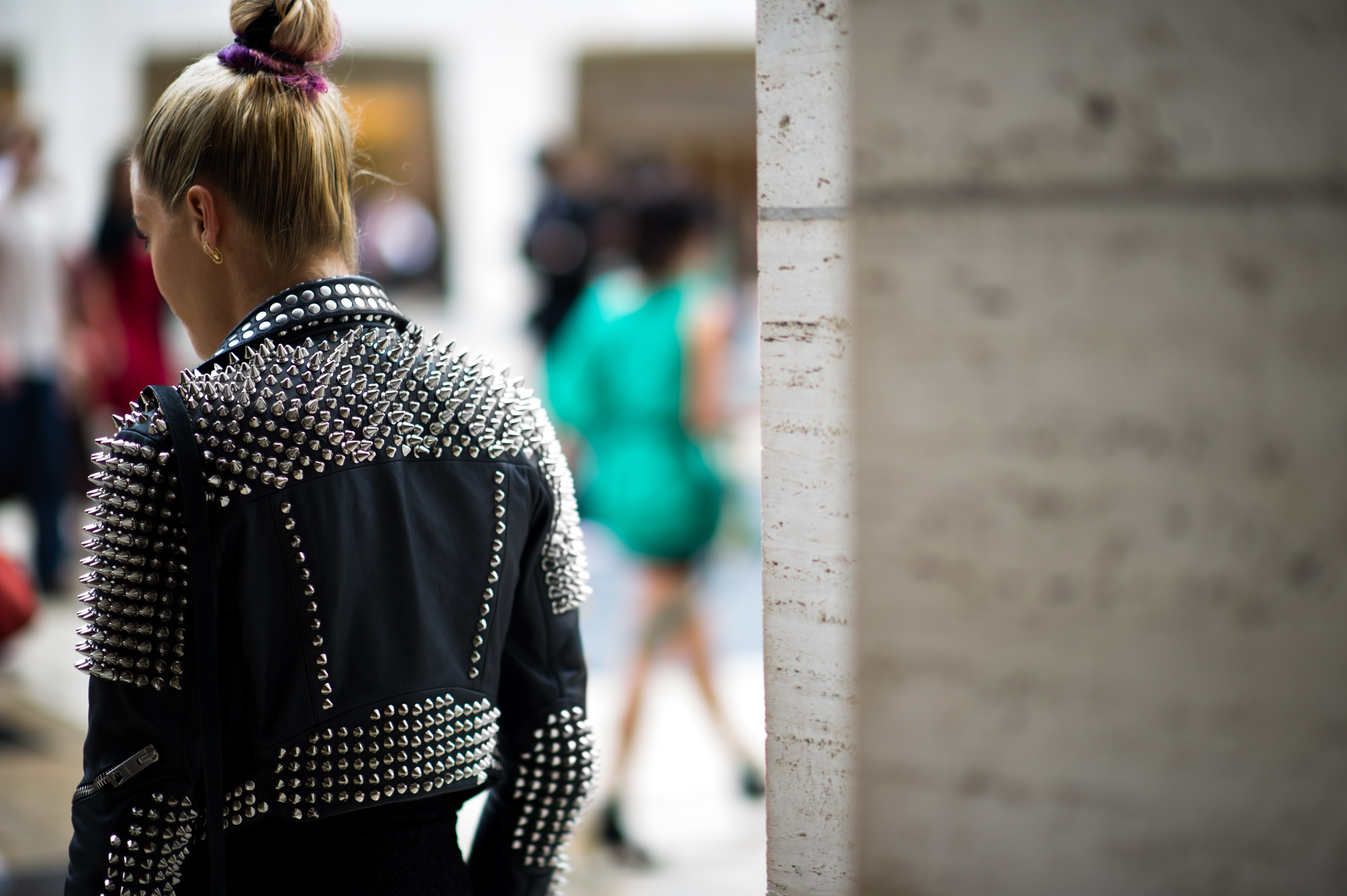 Woman wearing studded leather jacket