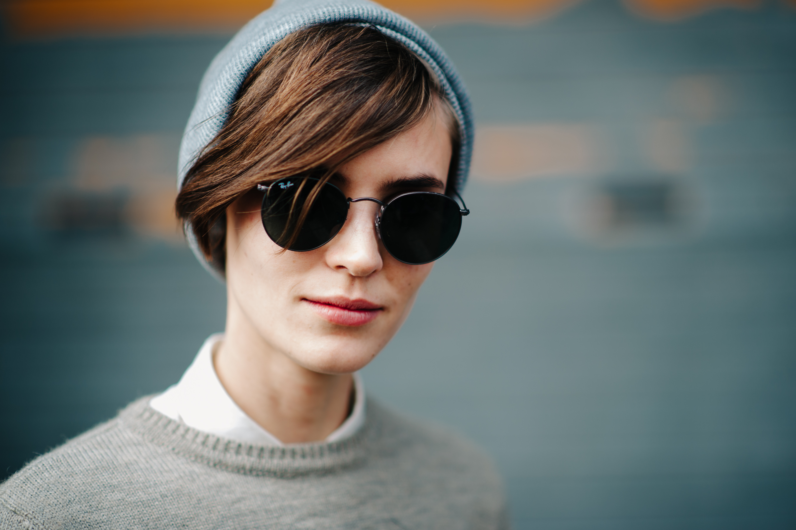 Portrait of a girl wearing grey hat