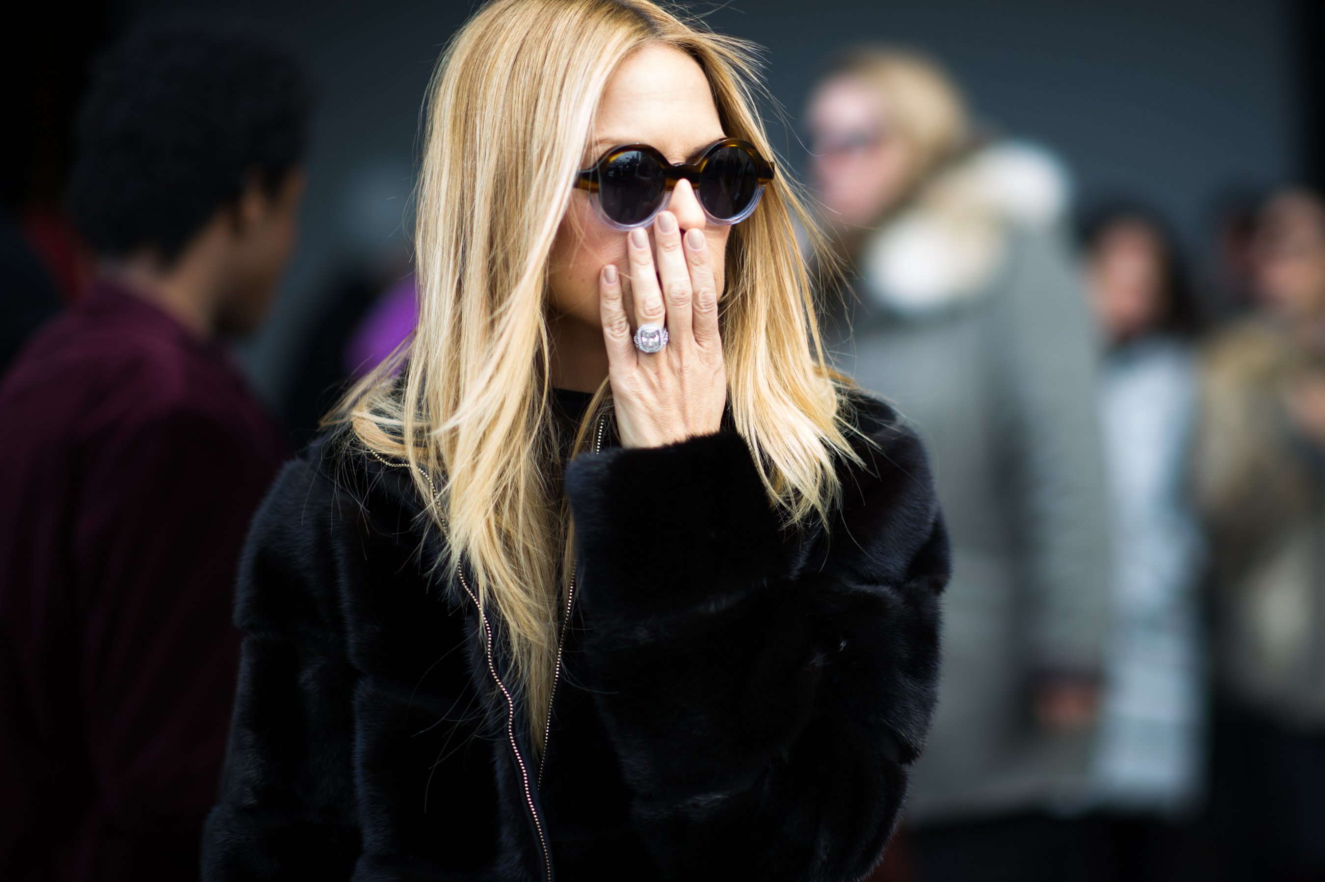 Blonde woman wearing round glasses