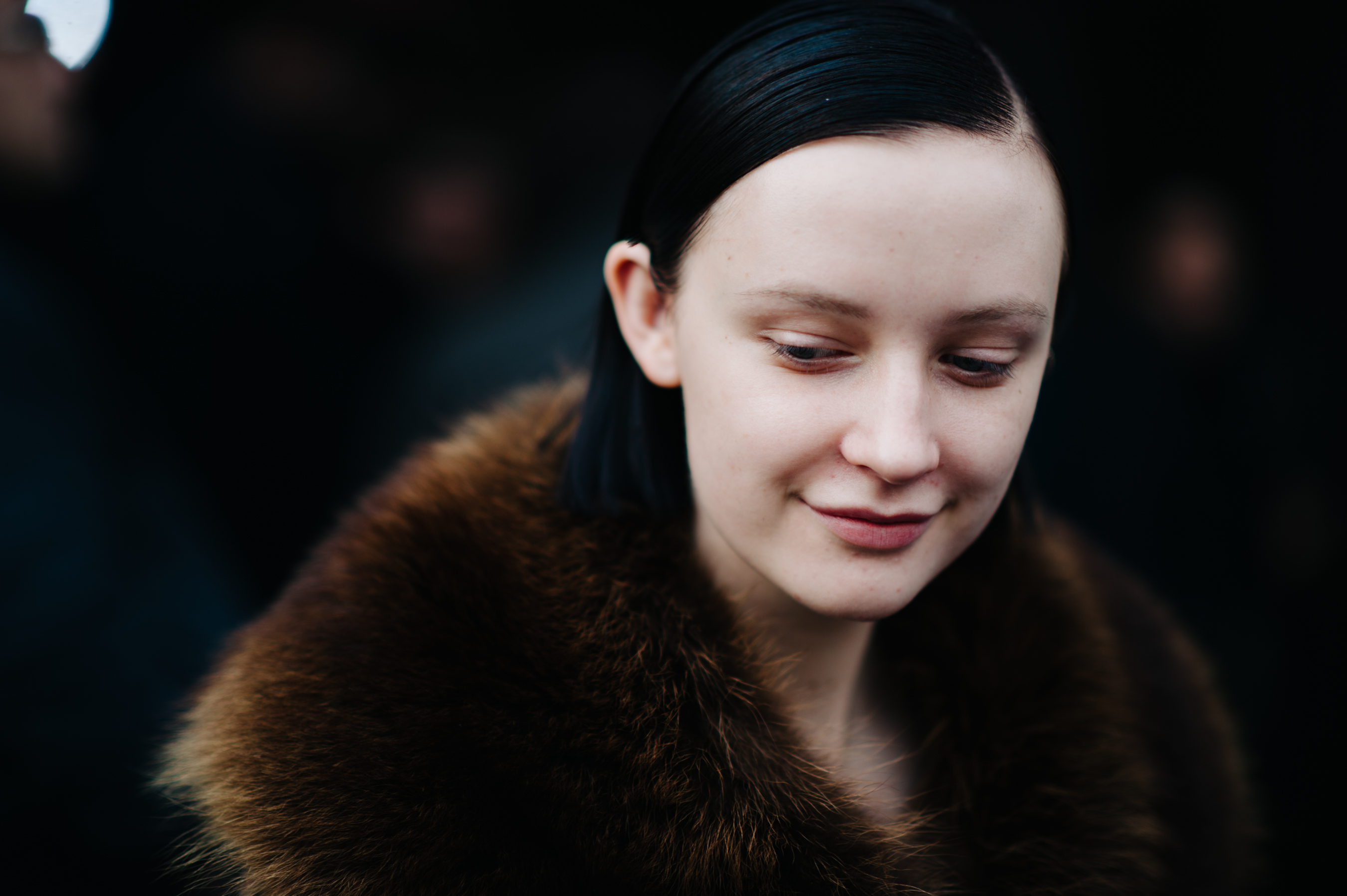 Model wearing fur coat after show