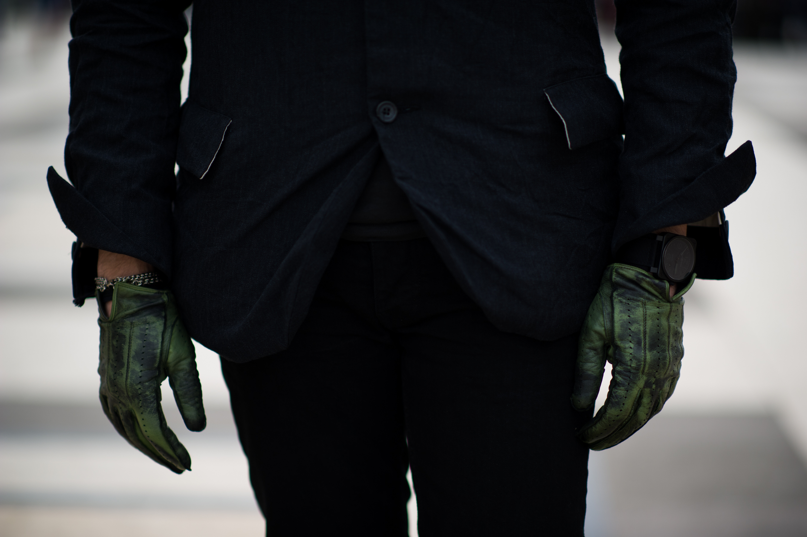 Man wearing green leather gloves