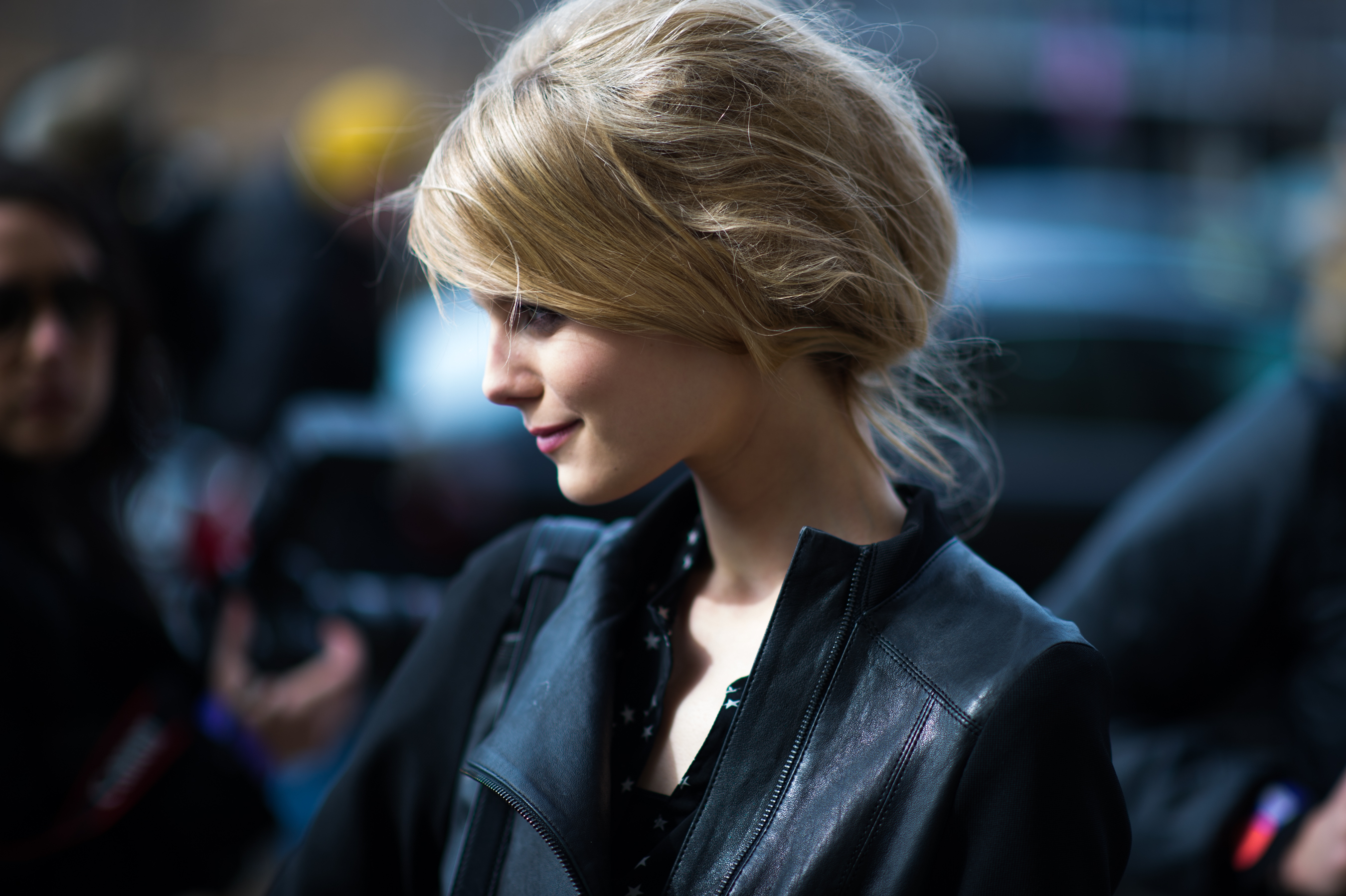 Model with blonde hair after show