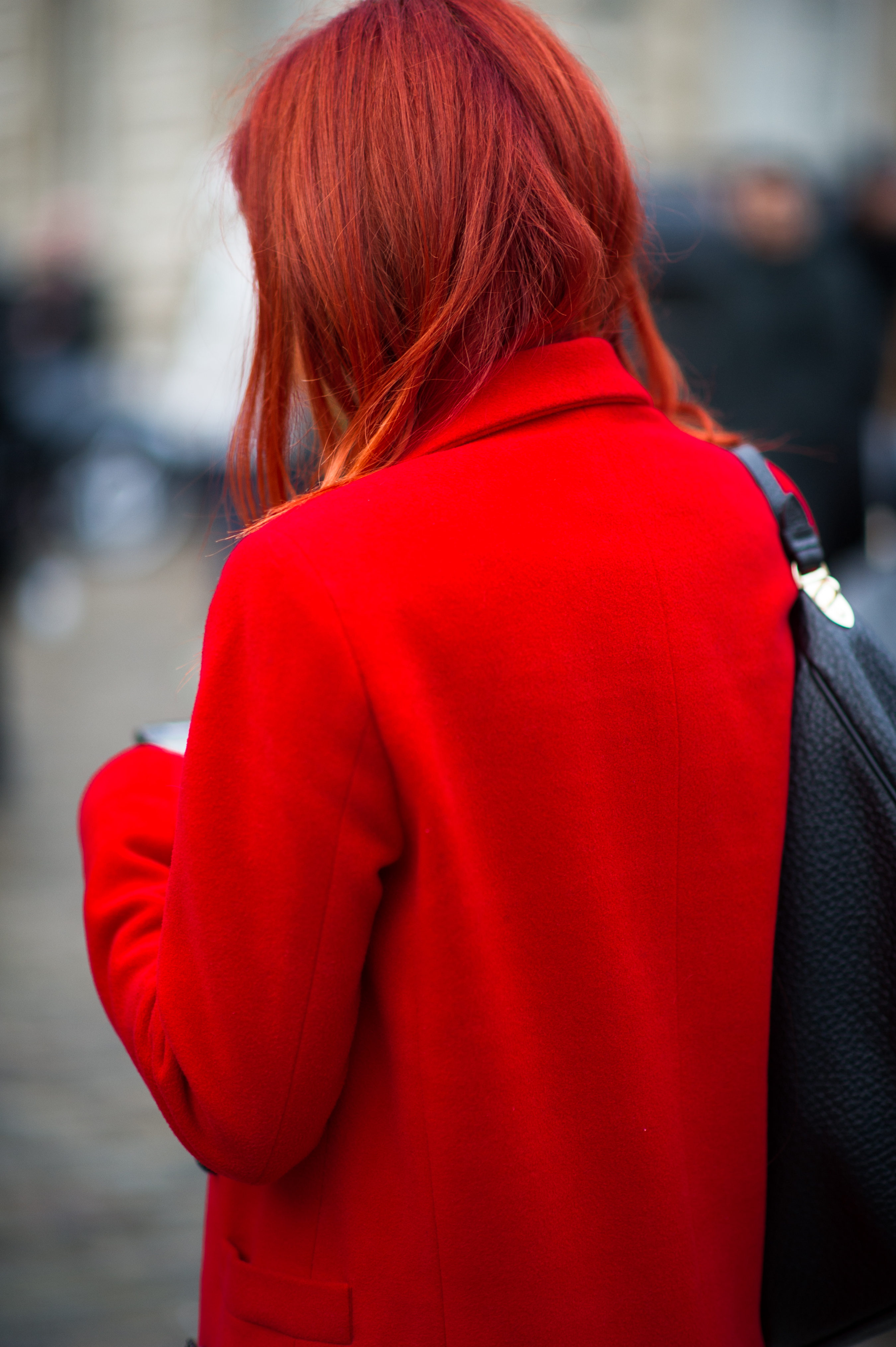 Woman with red hair wearing coat