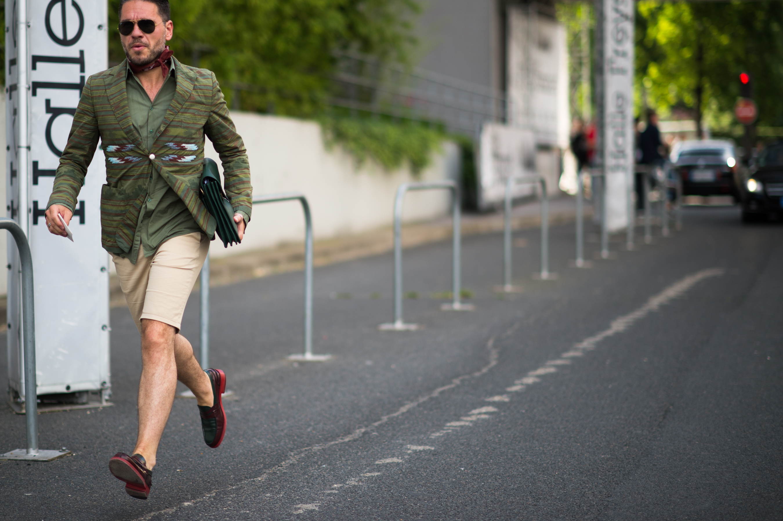 Man wearing green blazer and shorts