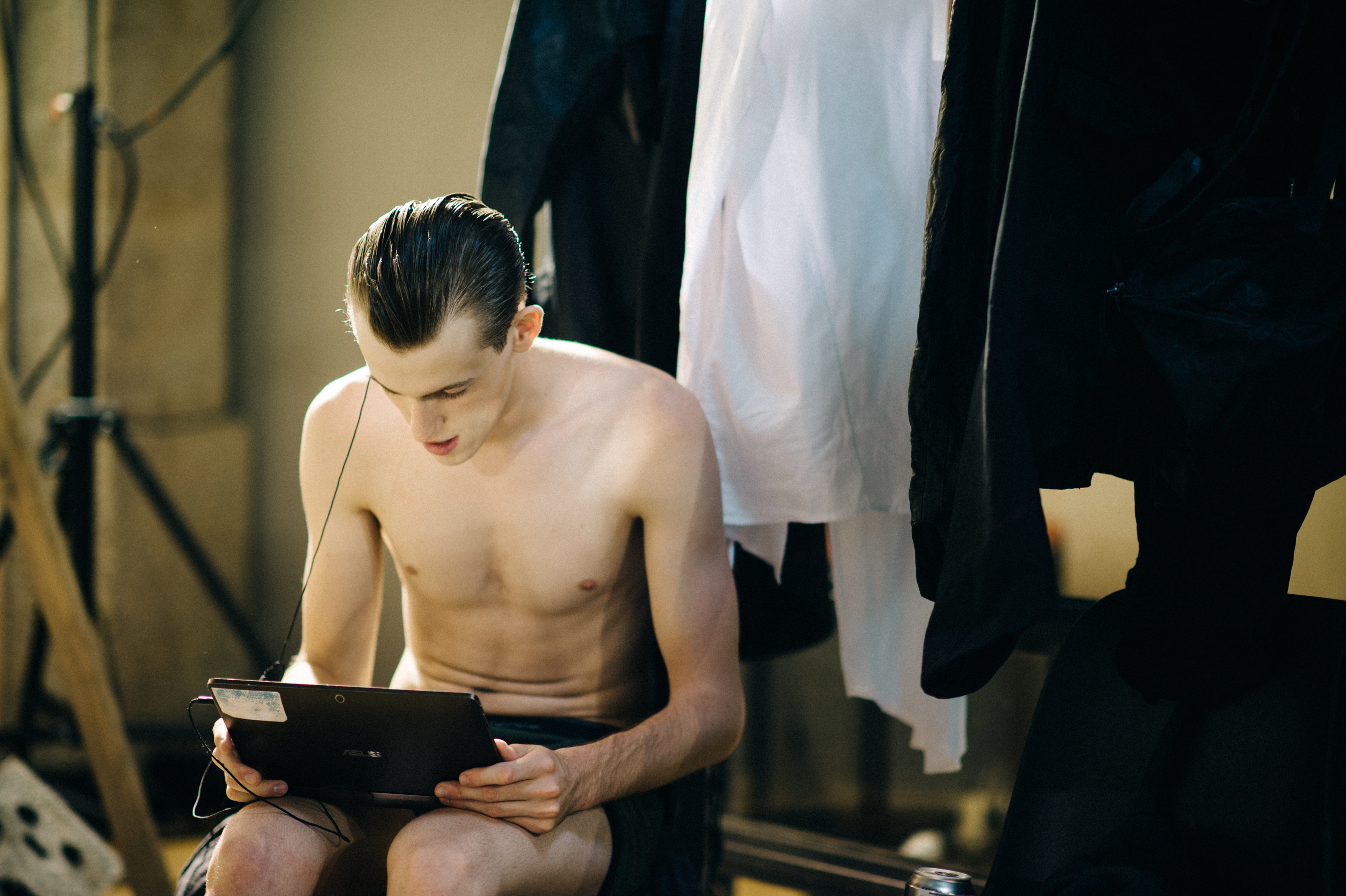 Male-Model-Watching-iPad-Backstage