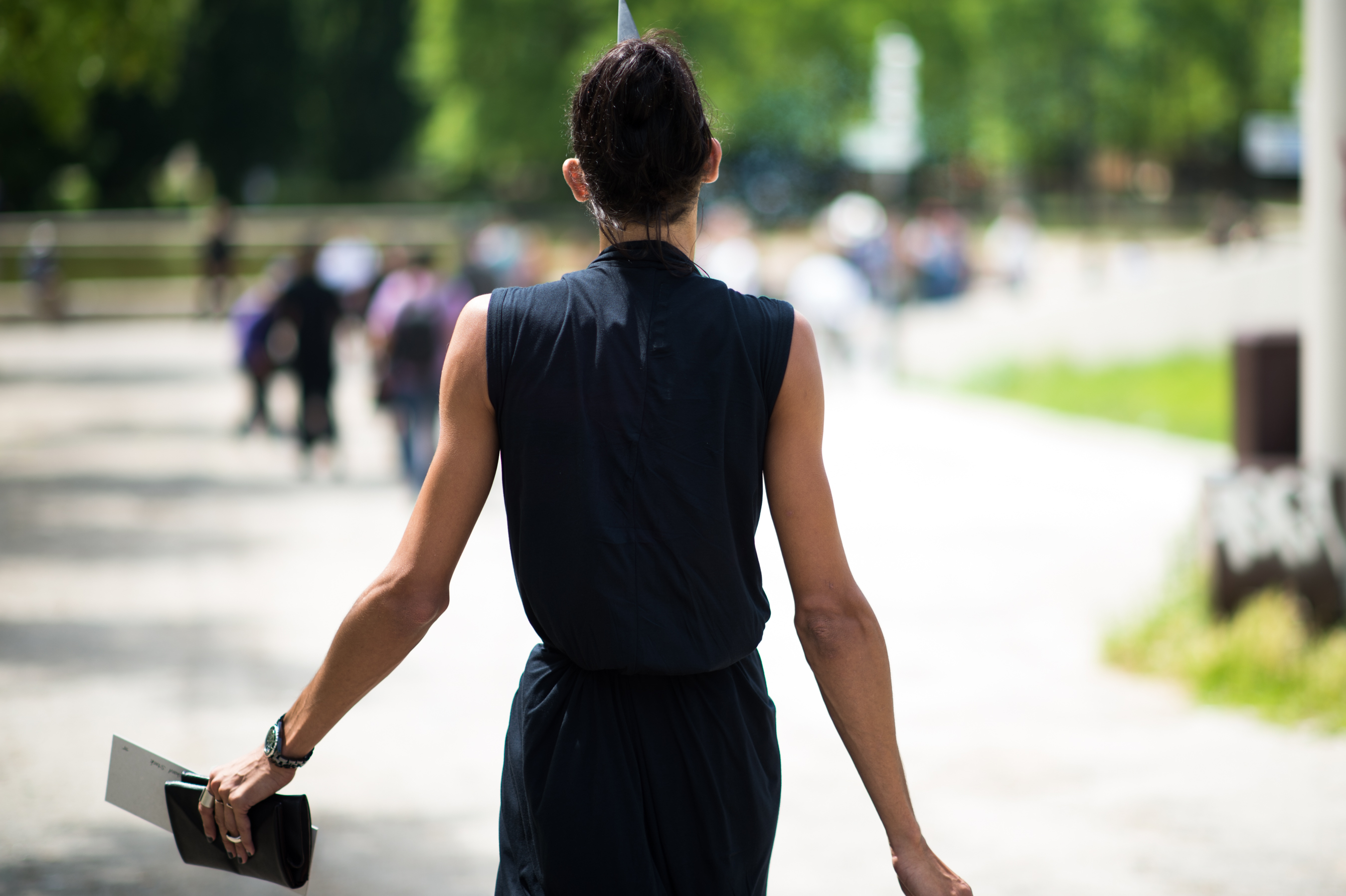 Woman wearing black sleeveless dress