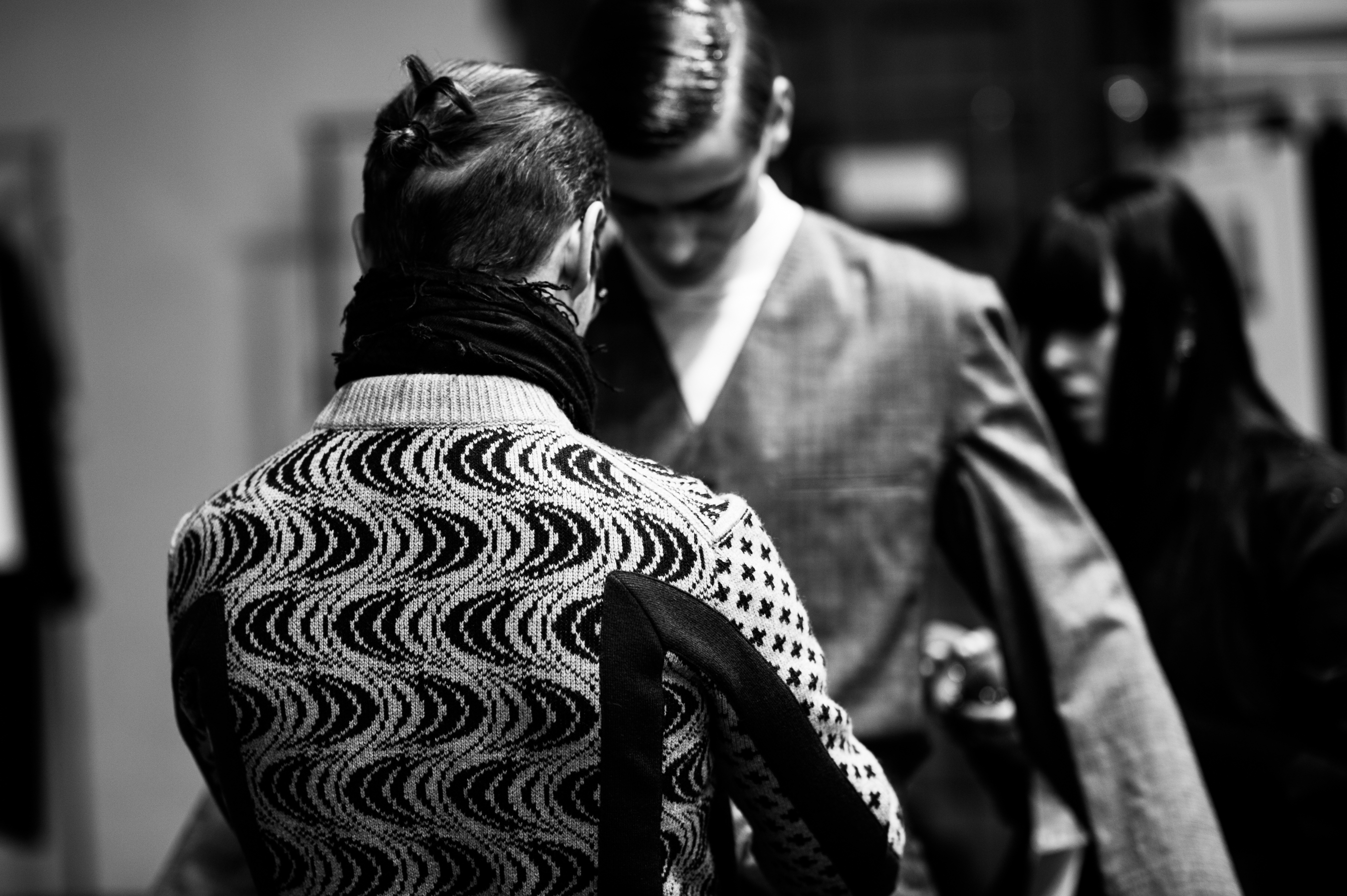Designer dressing up male model