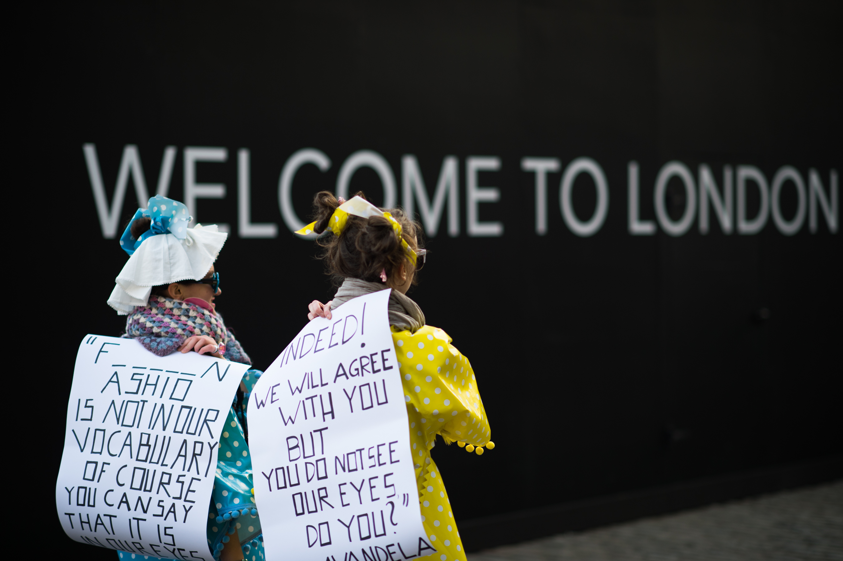 Two-Girl-Holding-Signs-LFW
