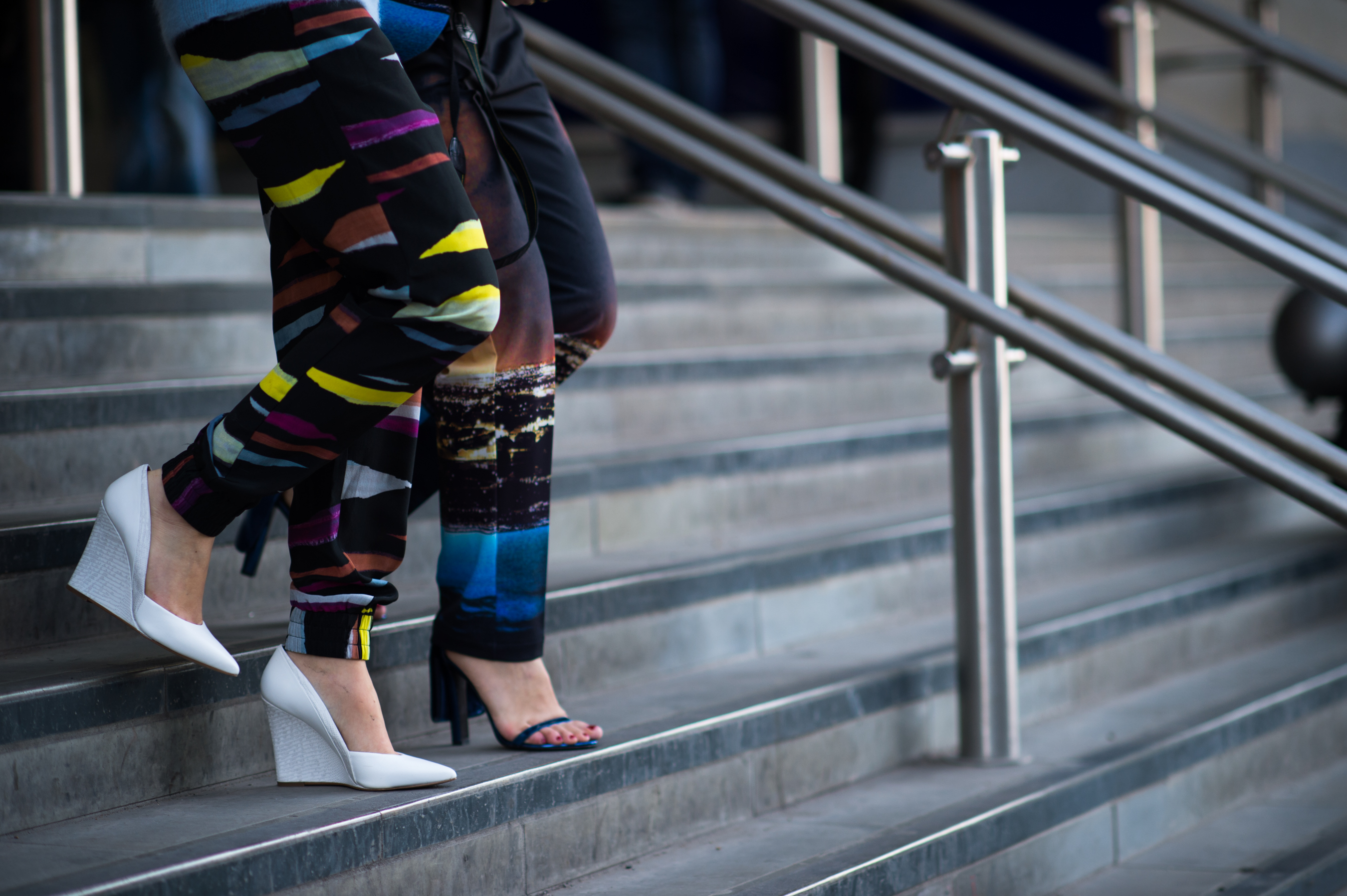 two women wearing print pants