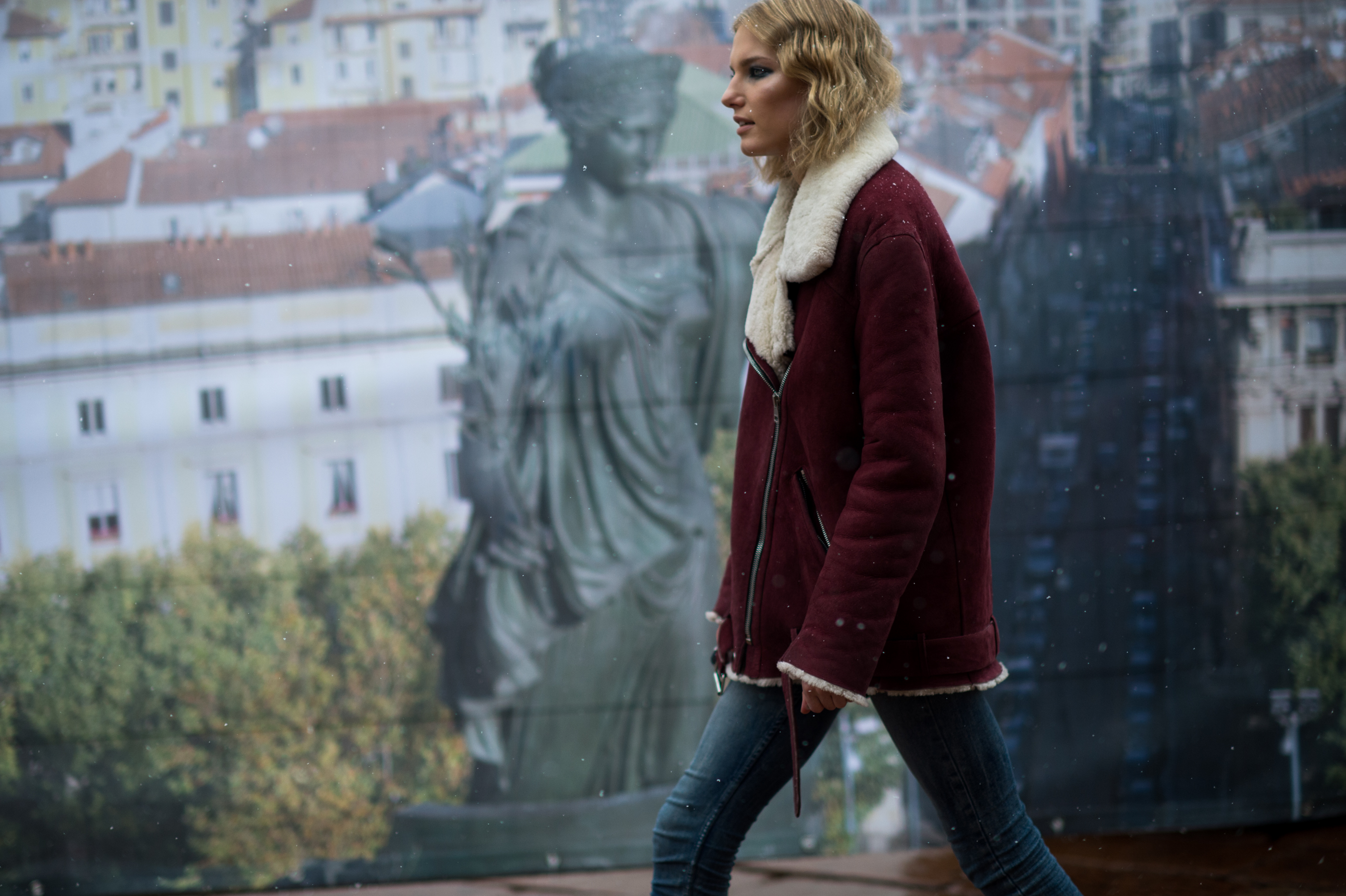 Dutch model wearing oxblood shearling coat