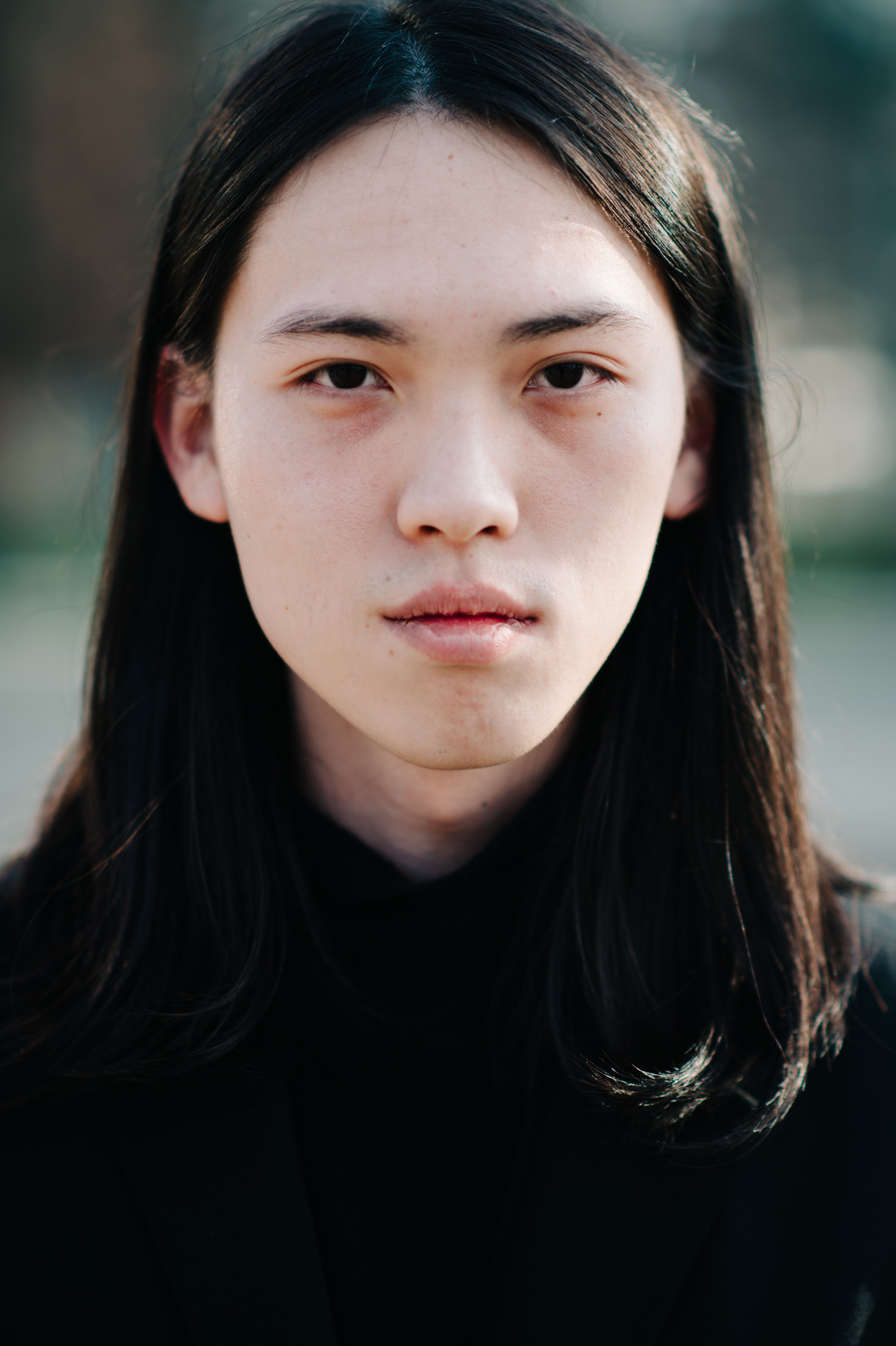 Portrait of man with long hair