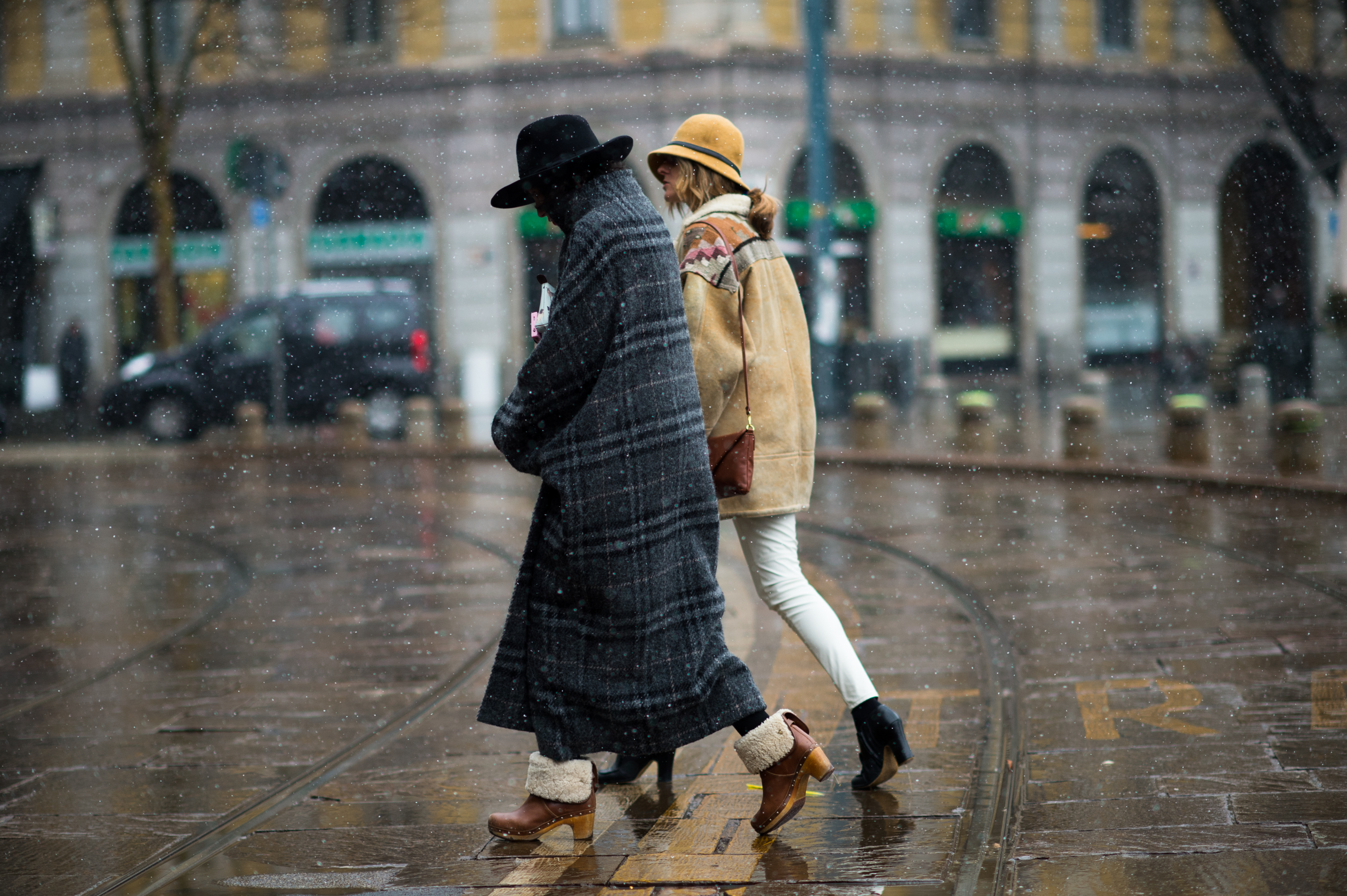Two women walking in the snow