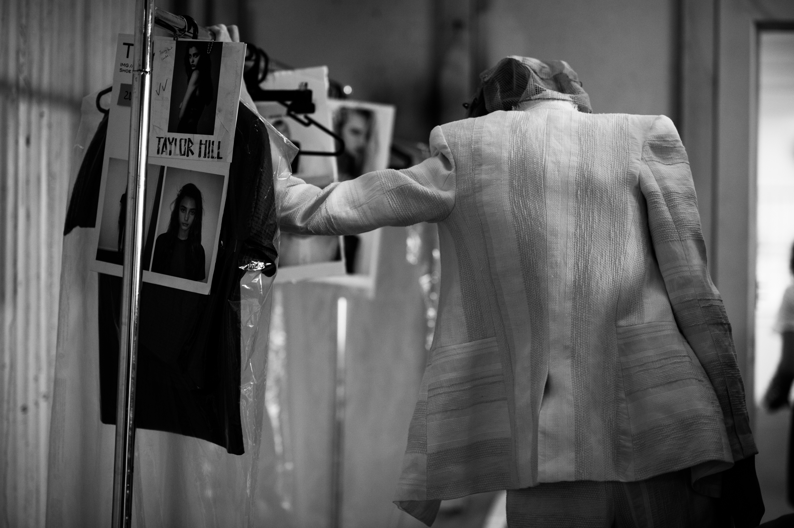 Model wearing suit before show