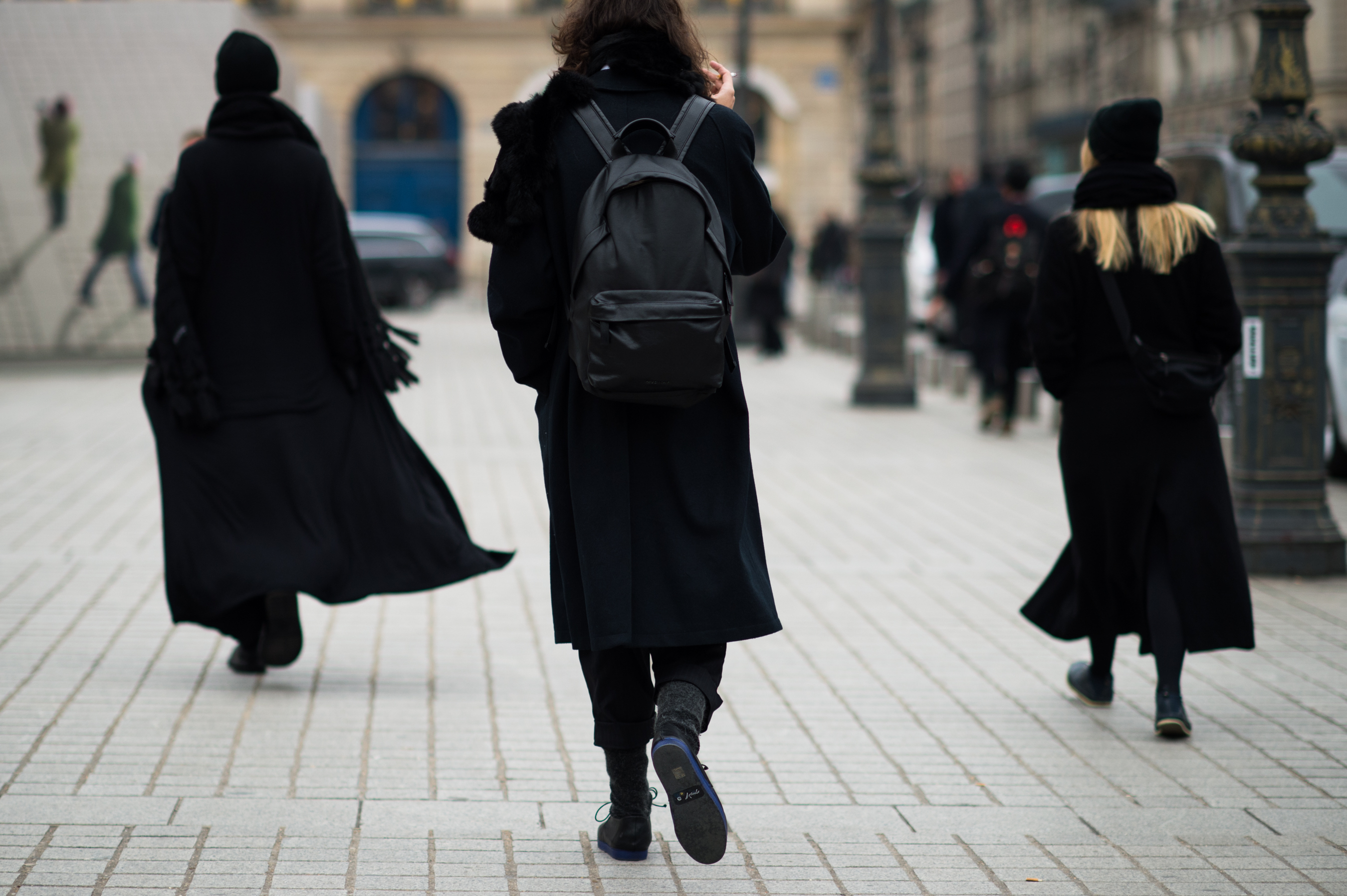 Three people wearing all black