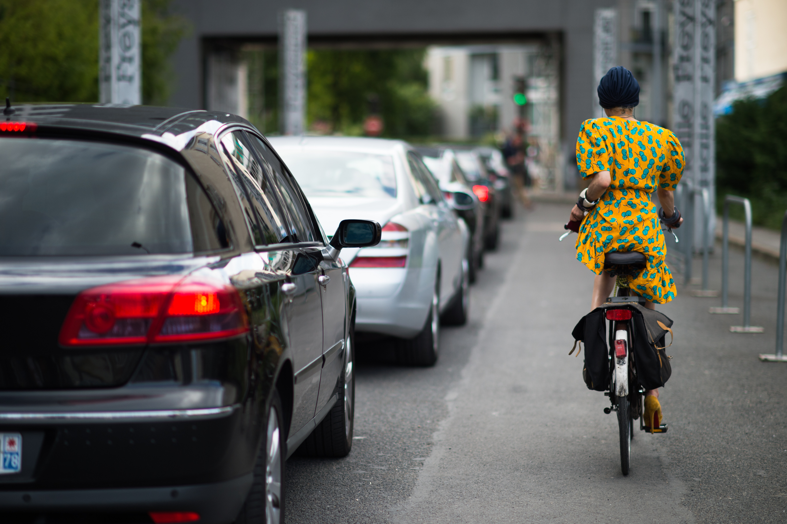 Woman in yellow dress on bicycle