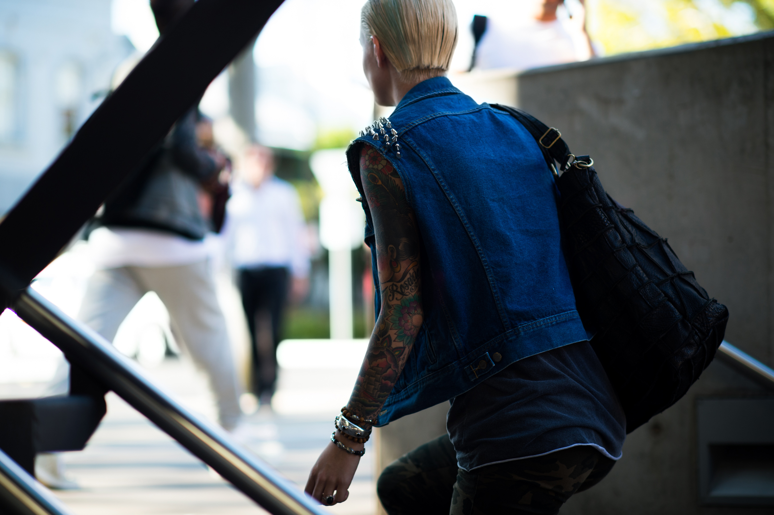 Tattoo blonde model denim vest