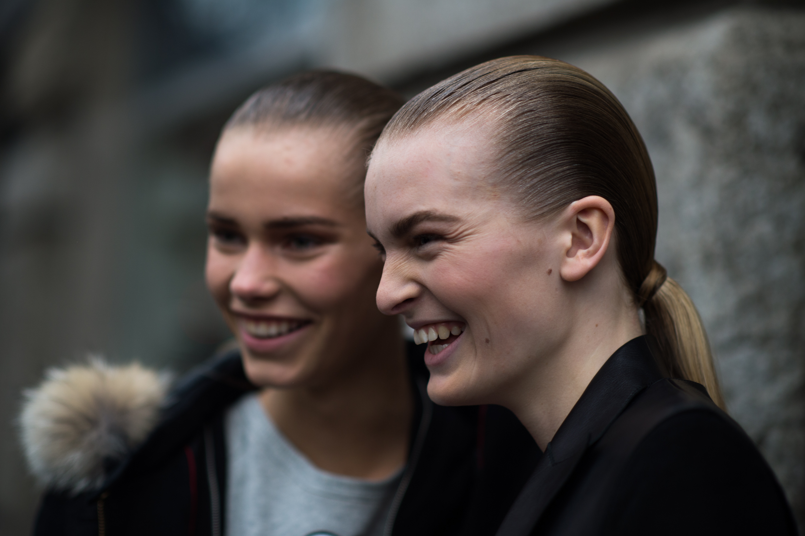 Two models smiling for camera