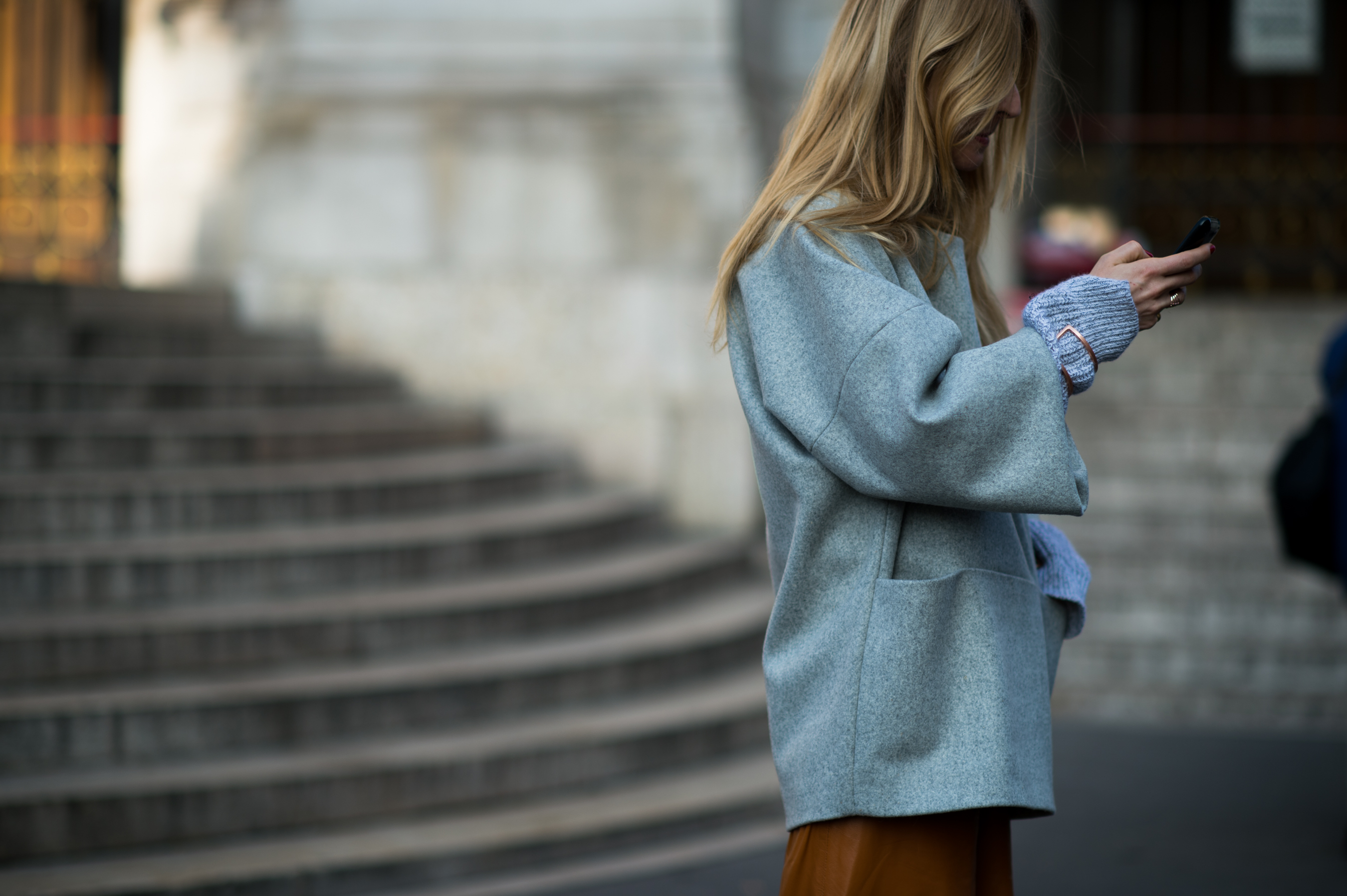 Stylist wearing grey heather coat