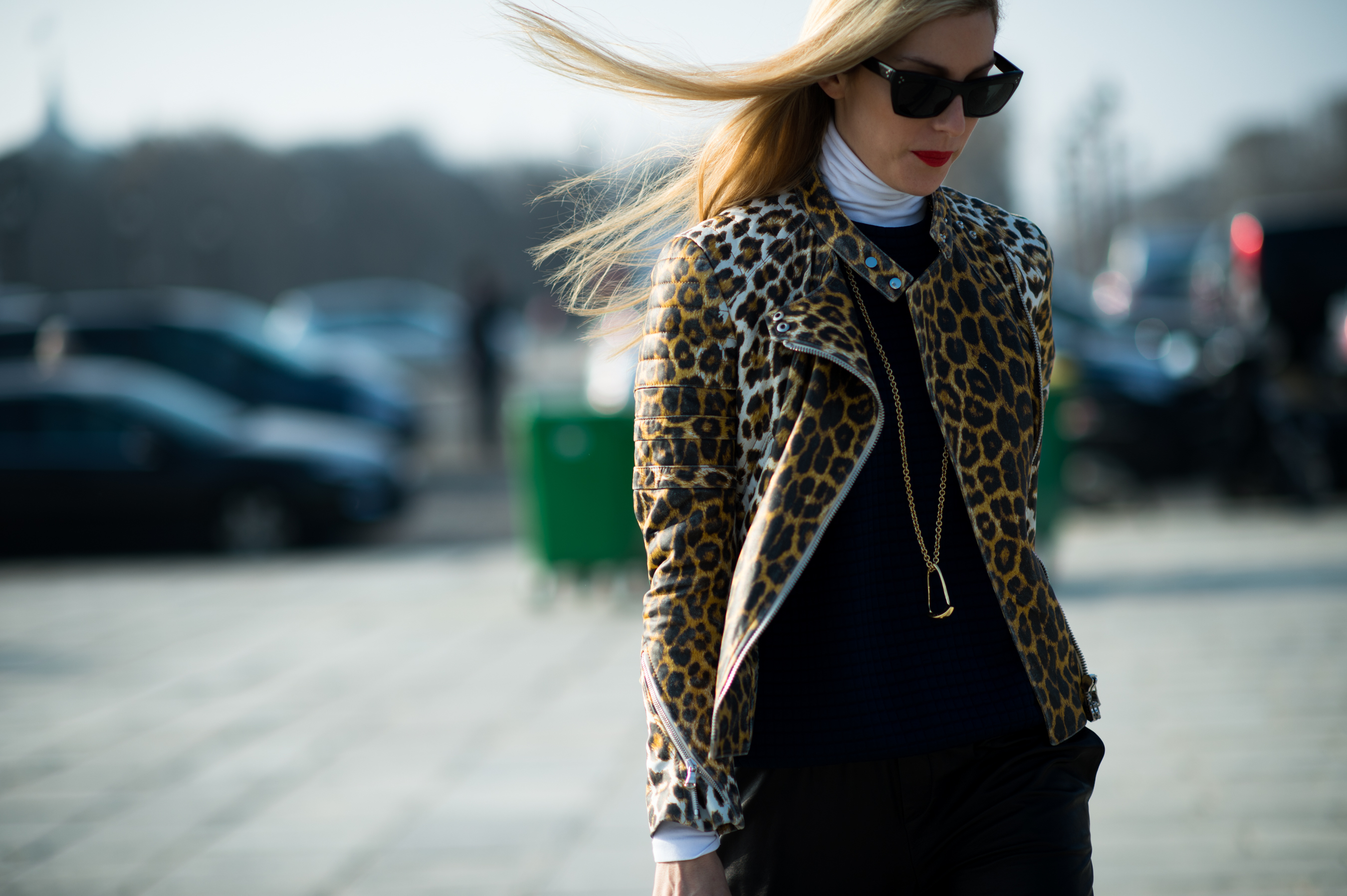 Blonde woman sunglasses leopard bomber