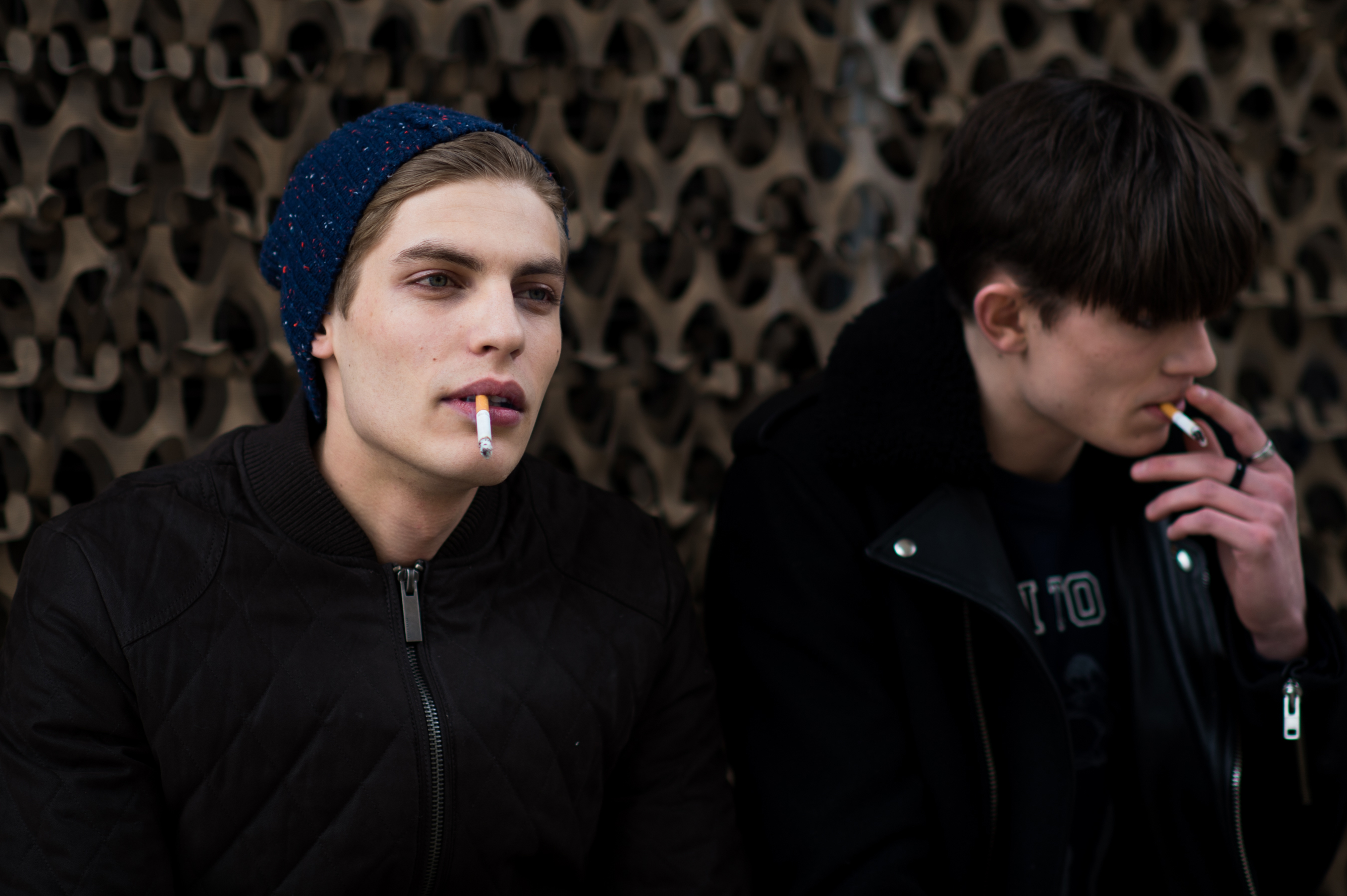 Two male models smoking cigarettes