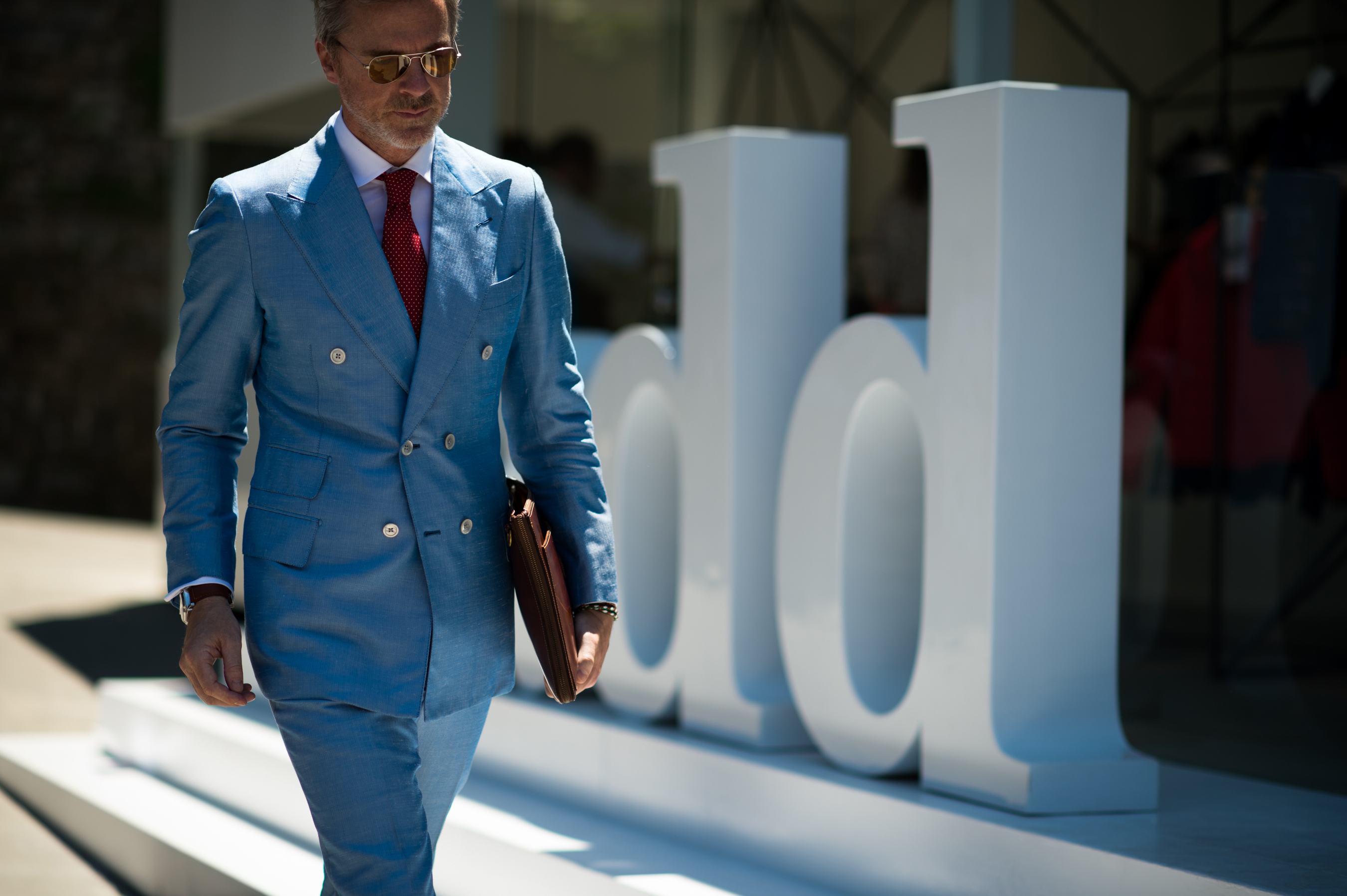 Man wearing blue double-breasted suit
