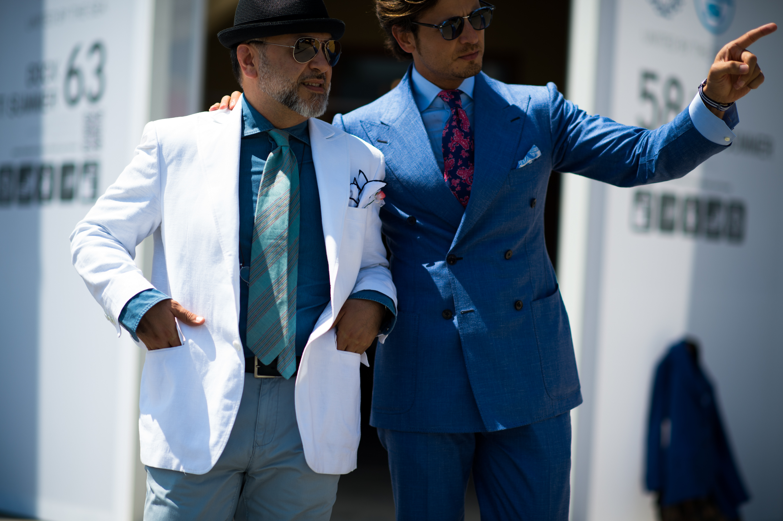 Two men wearing suits at Pitti Uomo
