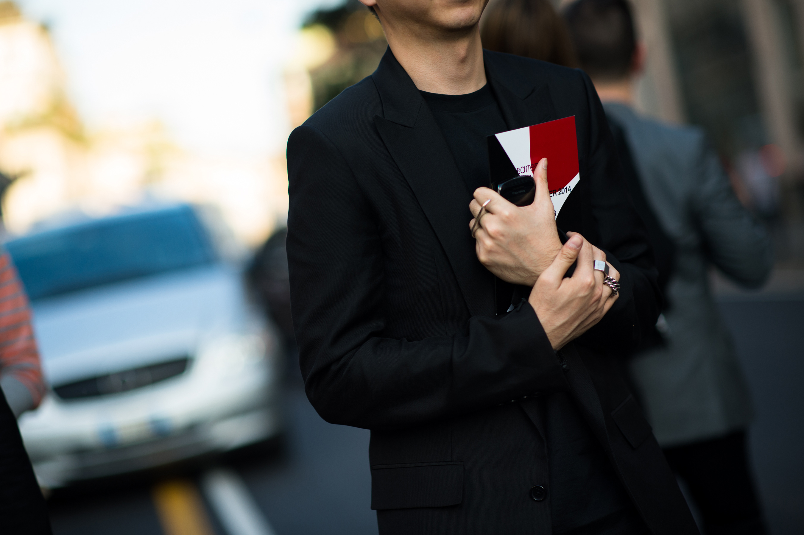 Chinese man wearing all black suit