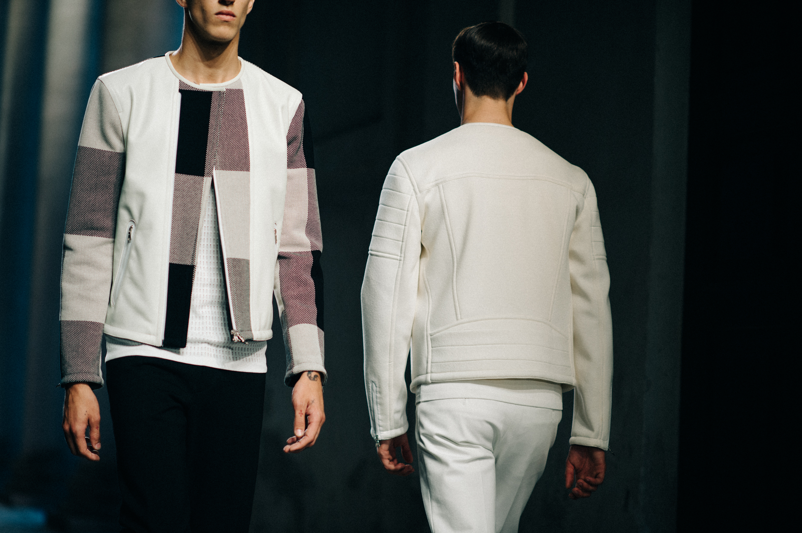 Two male models walking runway