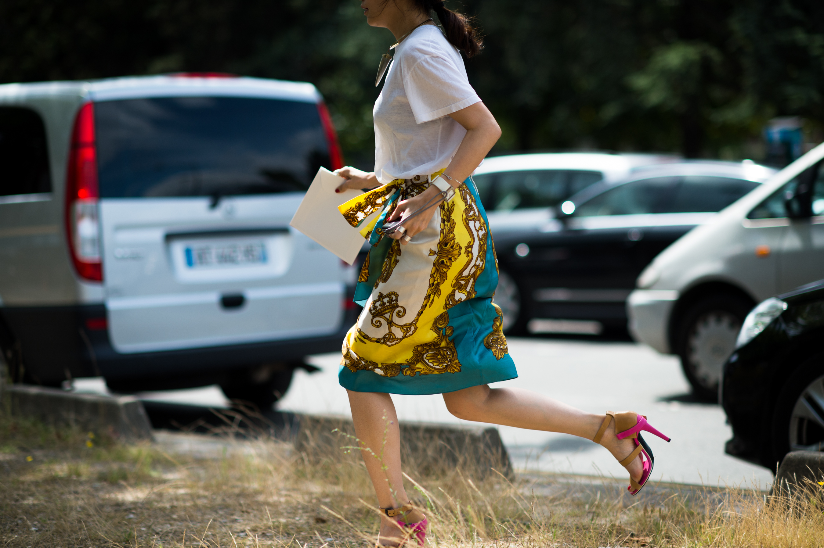 Chinese woman running in print skirt