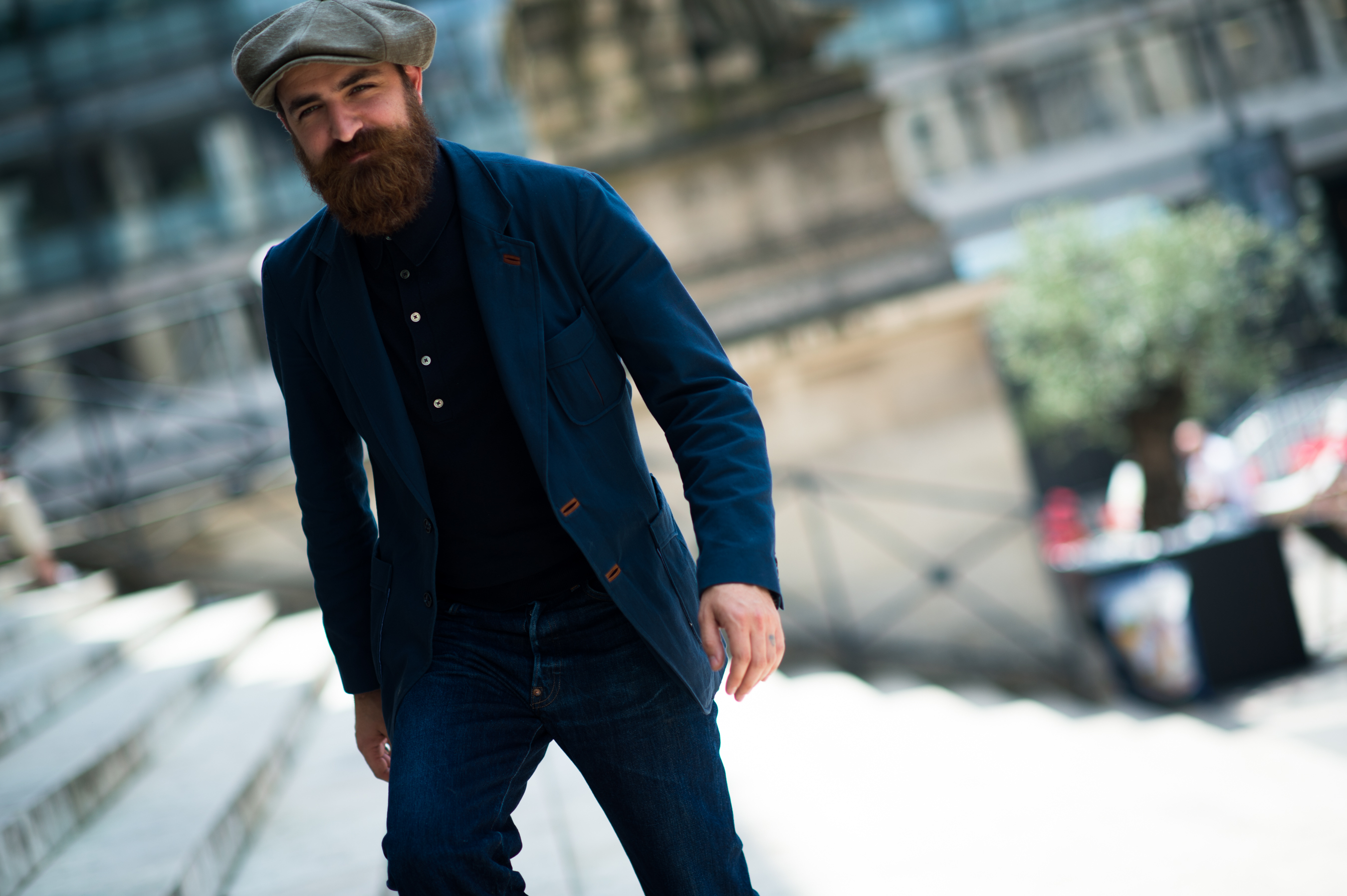 Man with beard wearing blue jacket