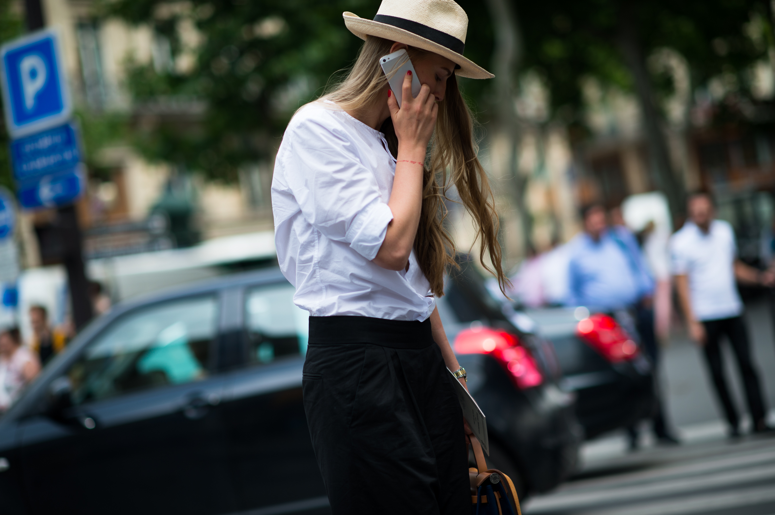 Woman wearing white shirt straw hat
