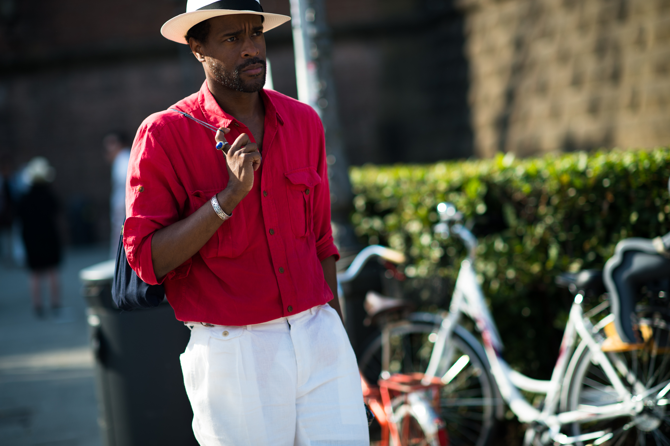 Guerrisms photographer red shirt white pants