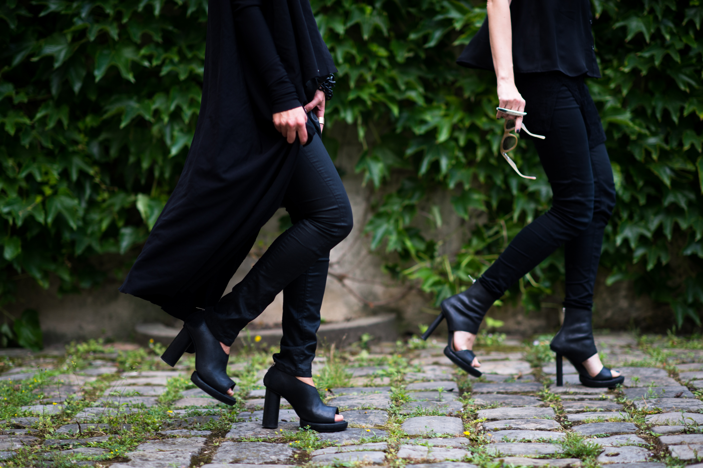 Two girls walking in black heels