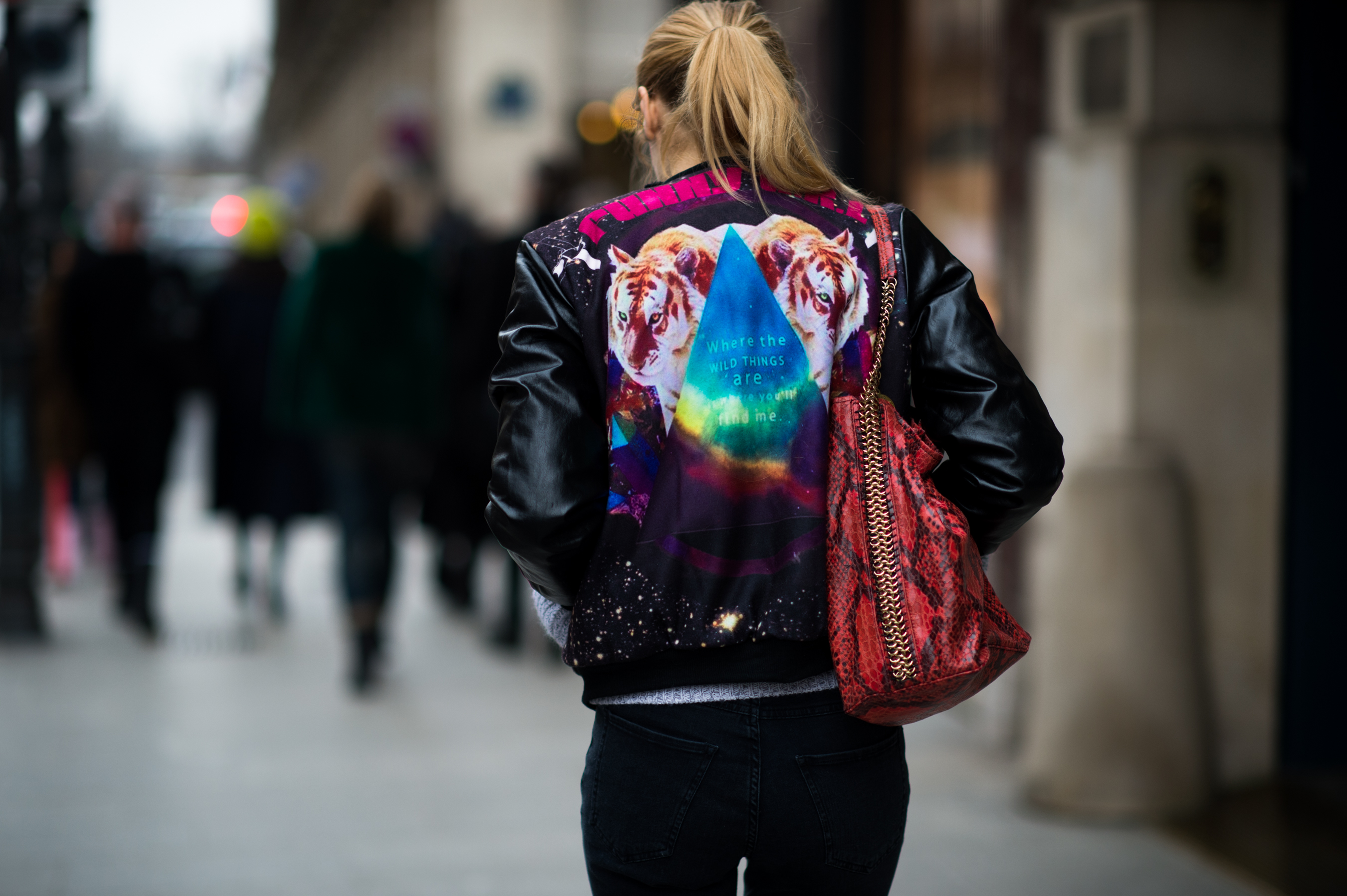 Woman wearing colourful varsity jacket
