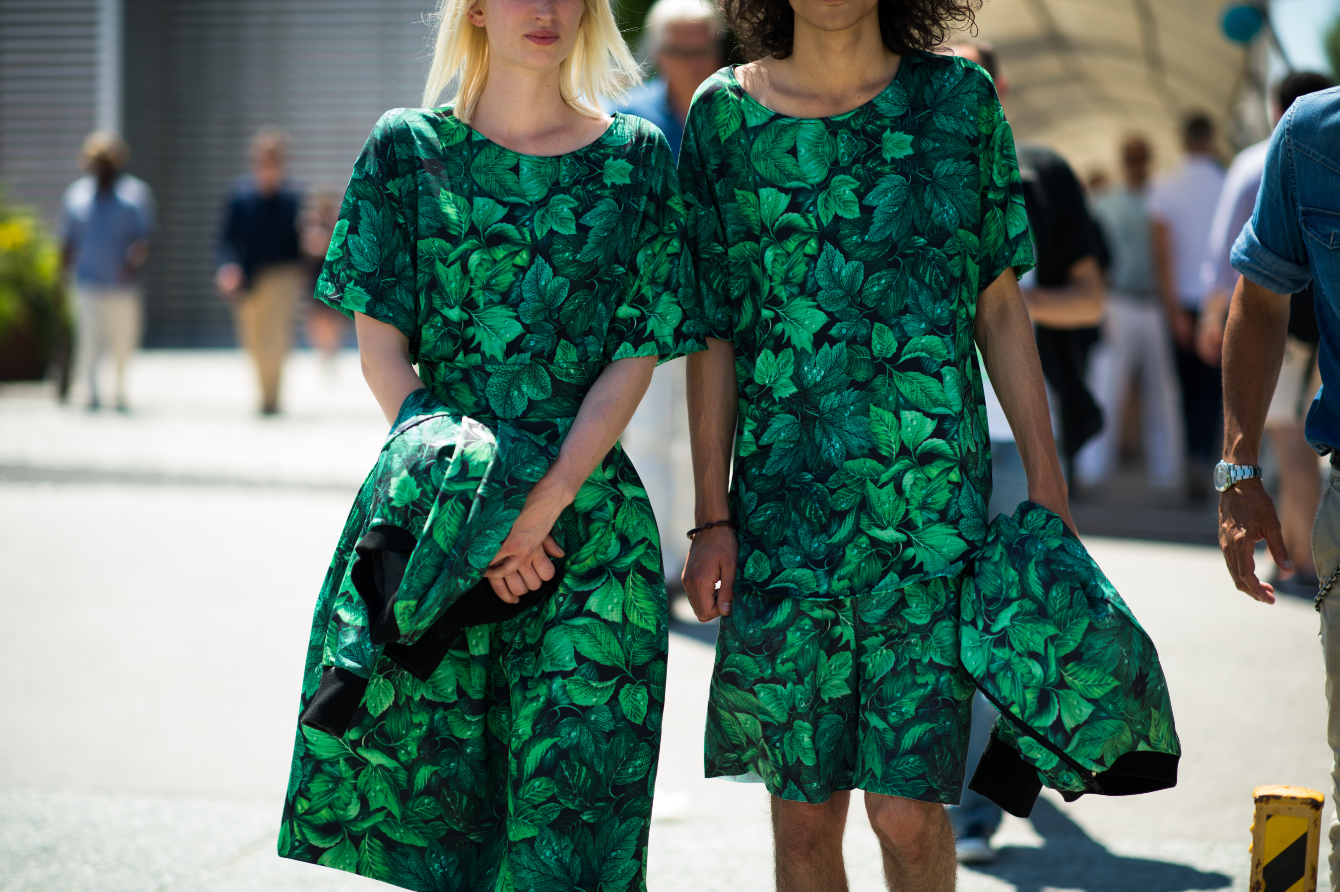 Man and woman wearing leaf print