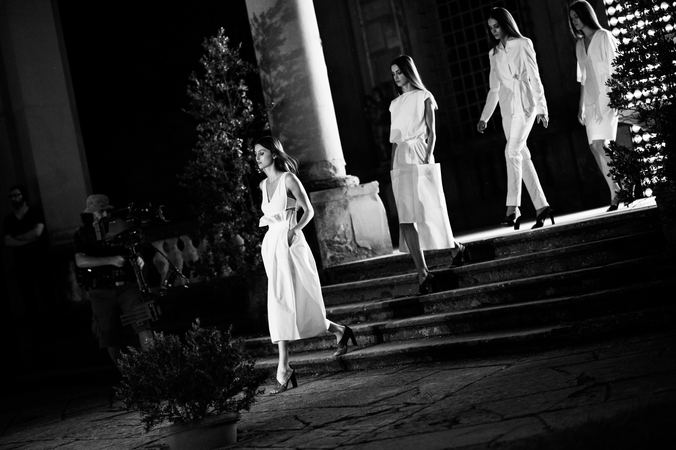 Models walking fashion show finale