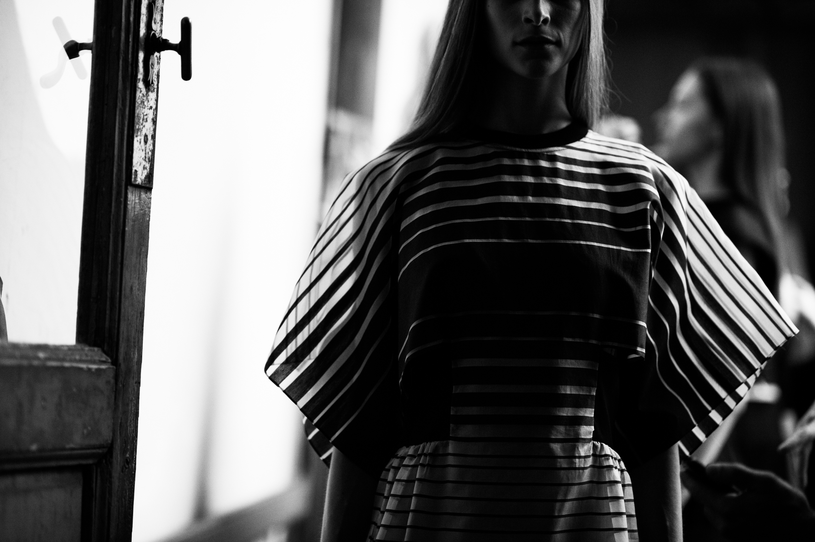 Model wearing sheer striped top