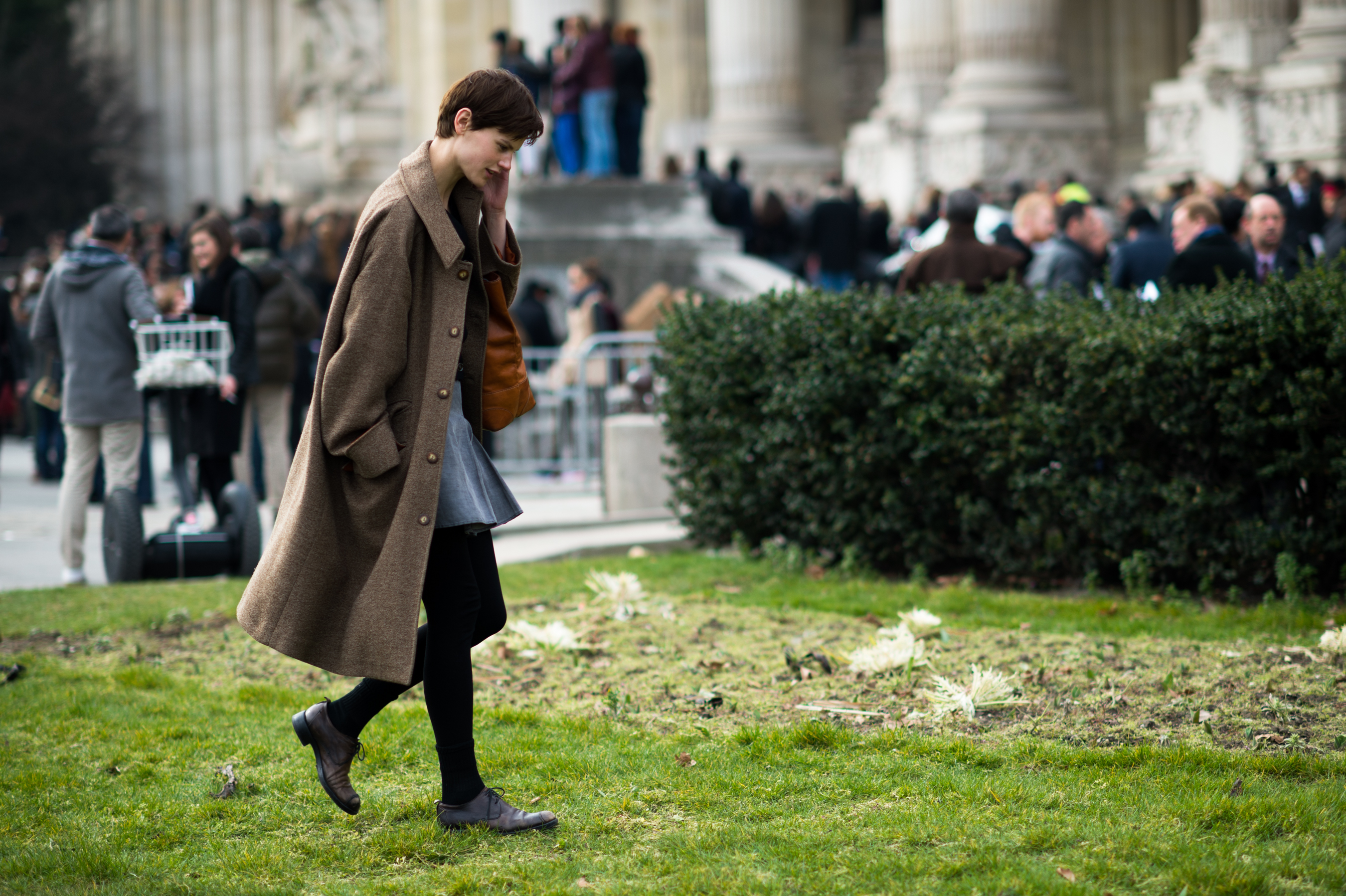 Model walking across lawn Grand Palais