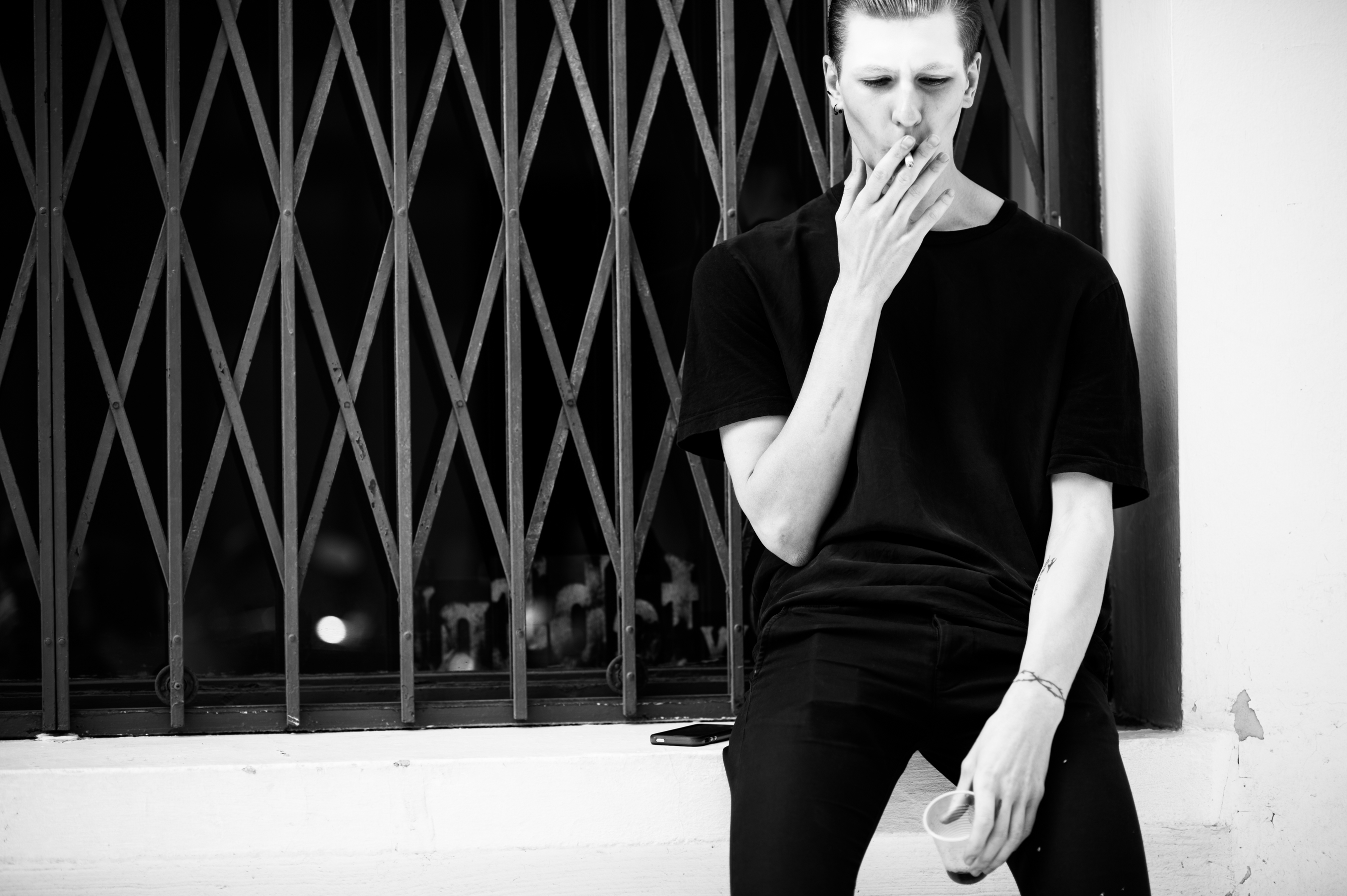 Male model smoking outside show