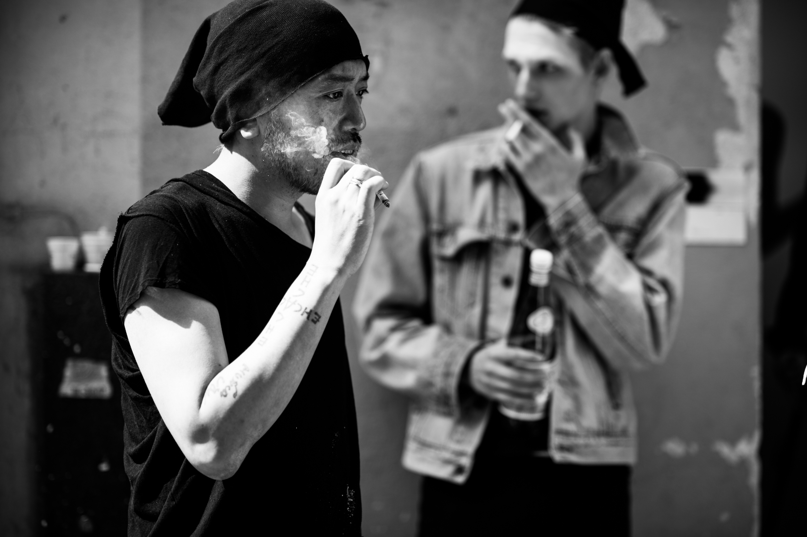 Designer and model smoking before show