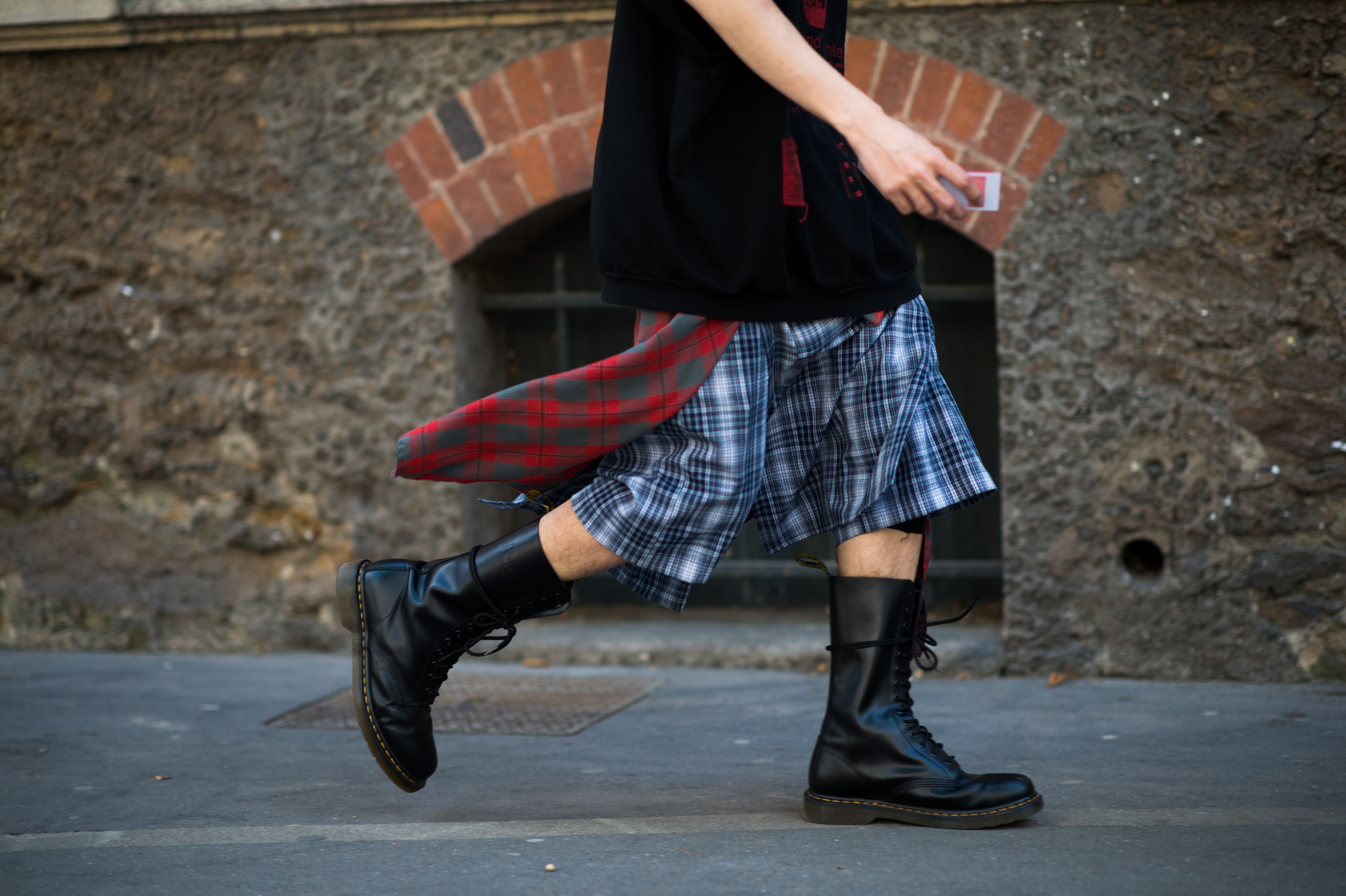 Man wearing Doc Martens and flannel